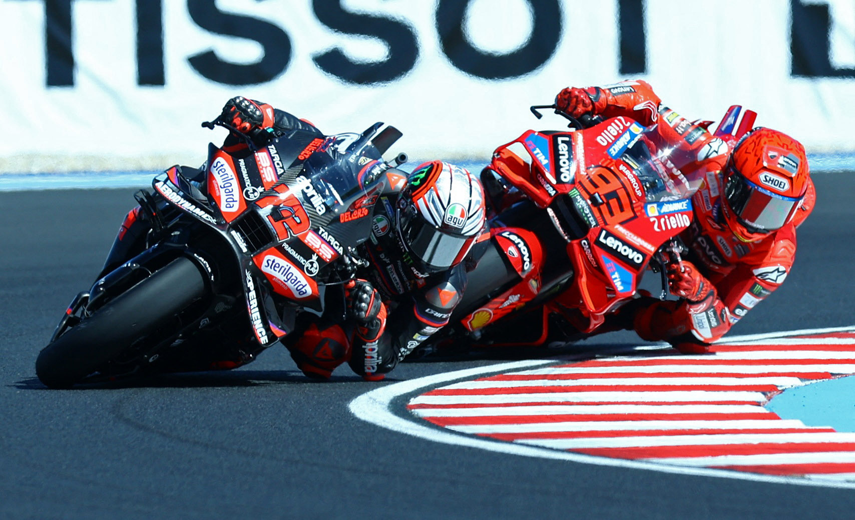 Marco Bezzecchi and Marc Marquez in action.