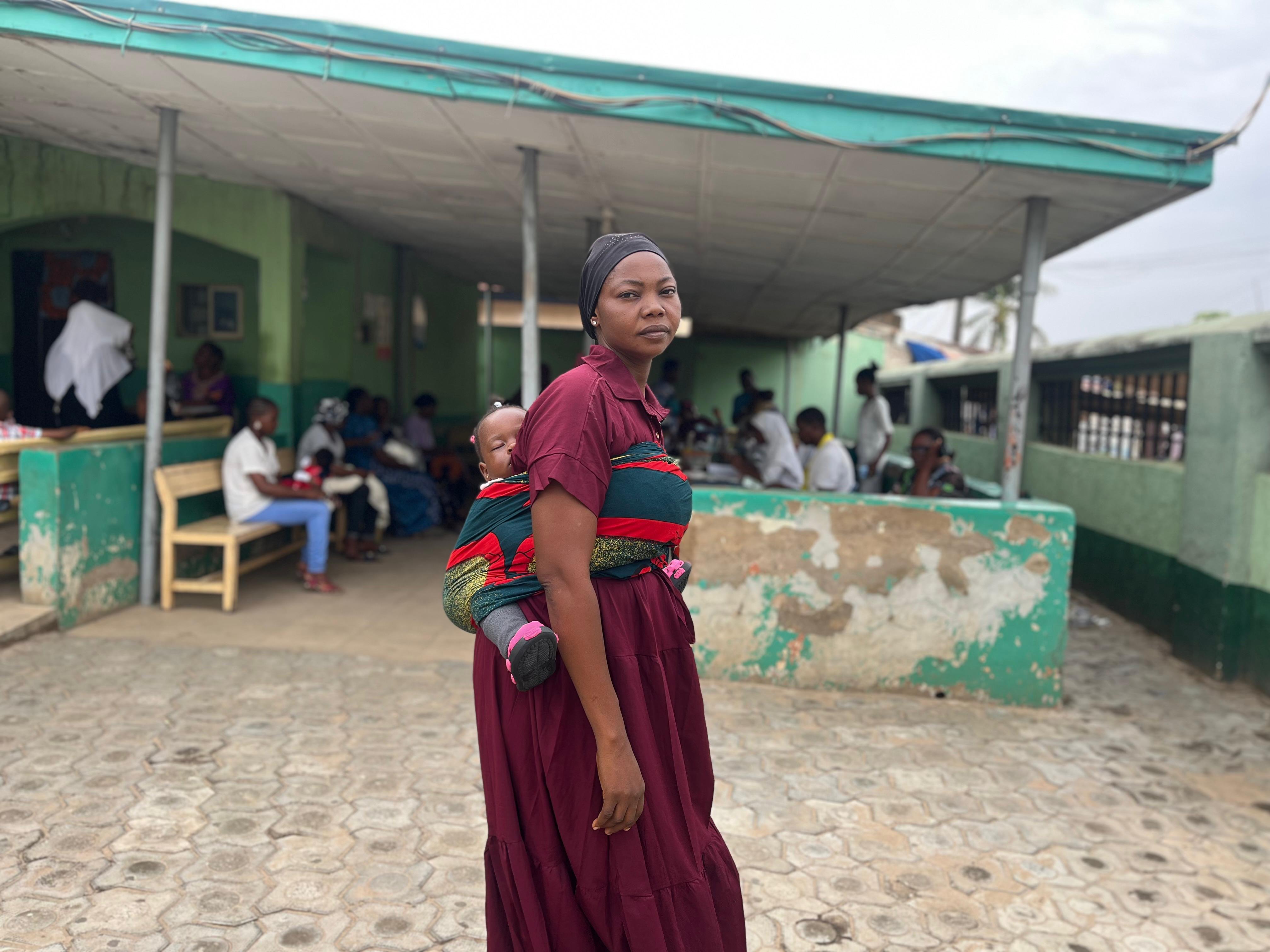 A woman in Nasarawa carrying her baby during the vaccination drive.