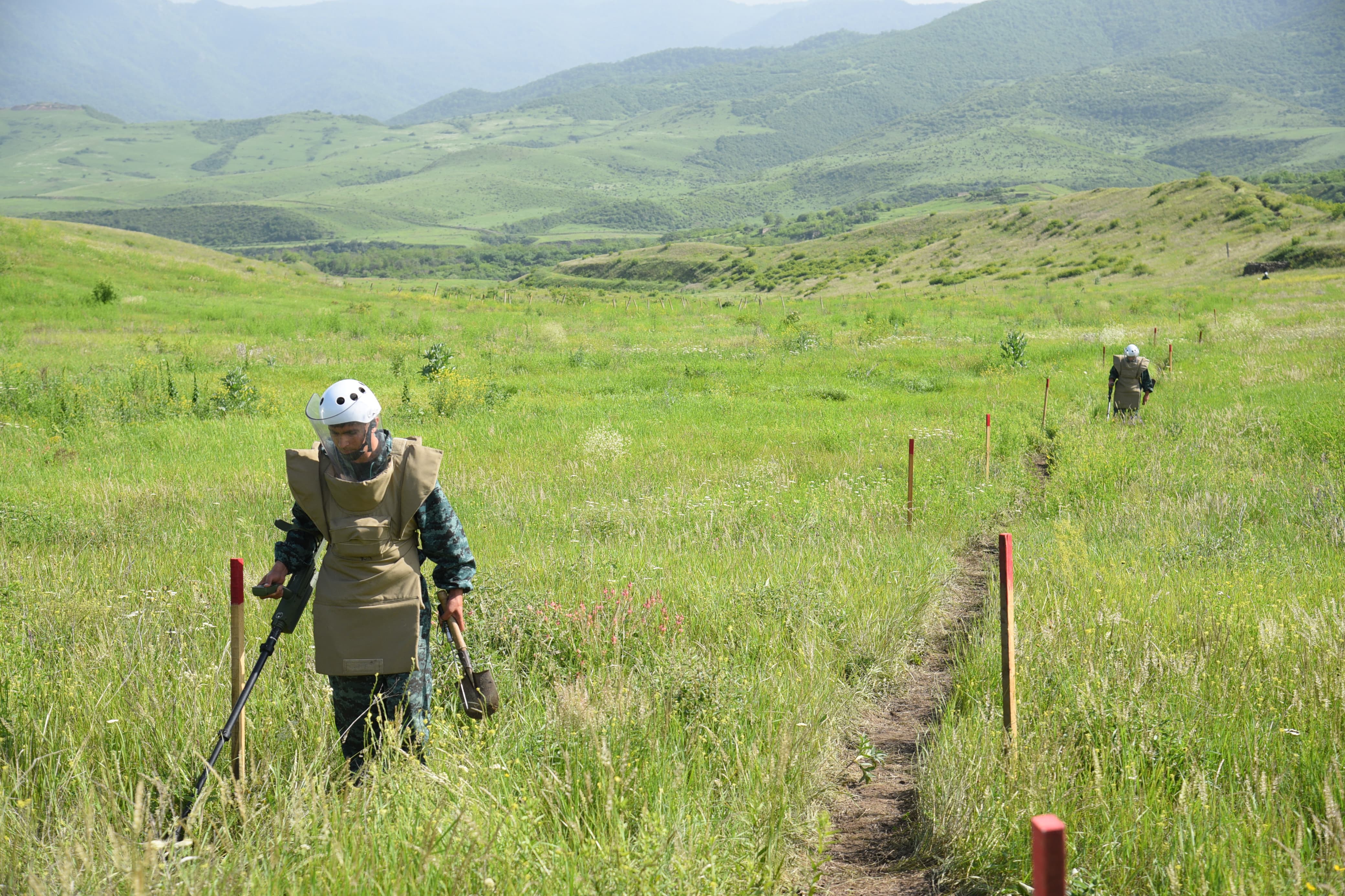 Azerbaijan's sappers inspect an area in the village of Ashaghi Askipara, one of the four villages Armenia recently returned to Azerbaijani control under border demarcation deal between the Caucasus rivals -- who fought two wars for control of the Nagorno-Karabakh region, on May 28, 2024. (Photo by AFP)
