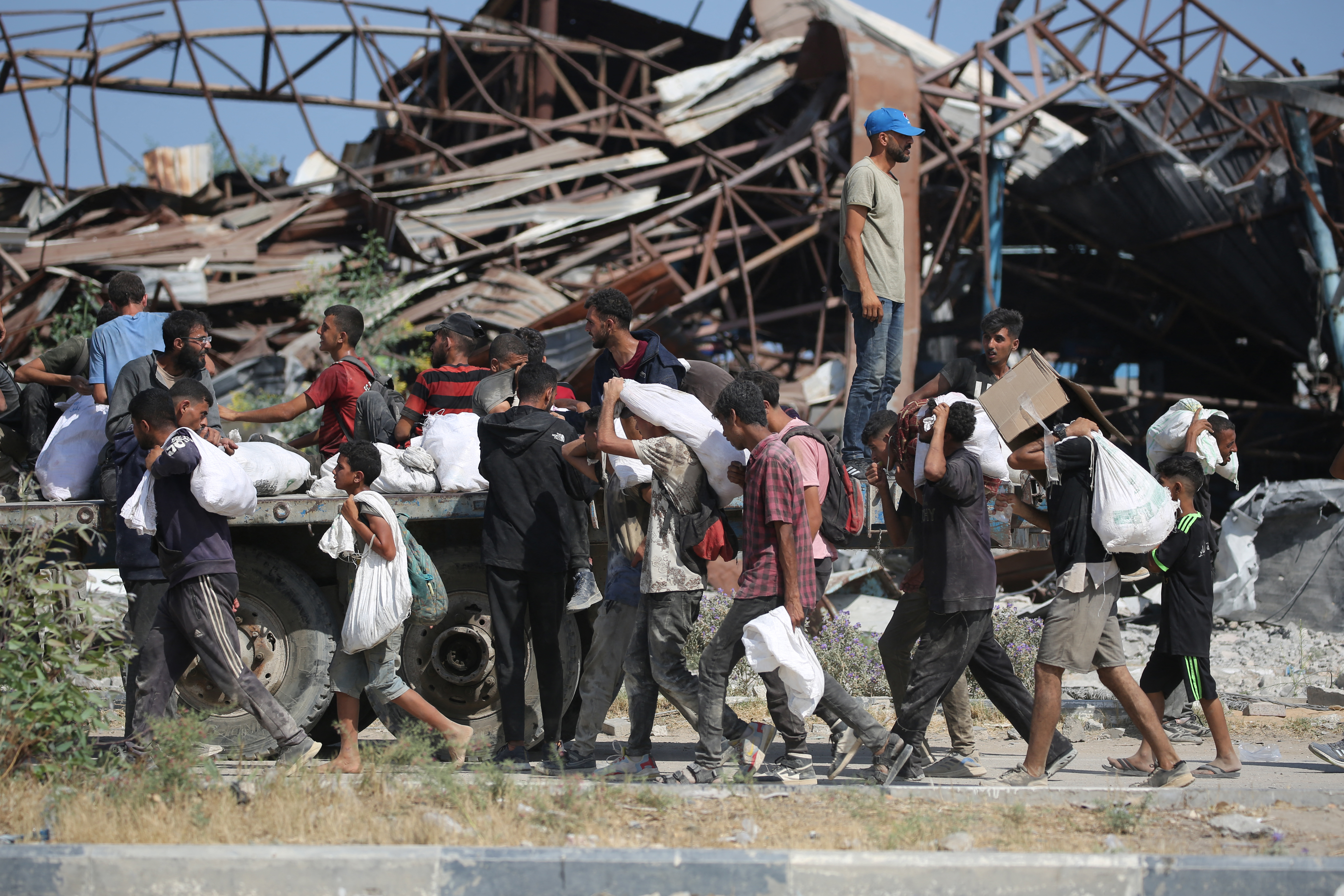 Palestinians leave a food distribution point.