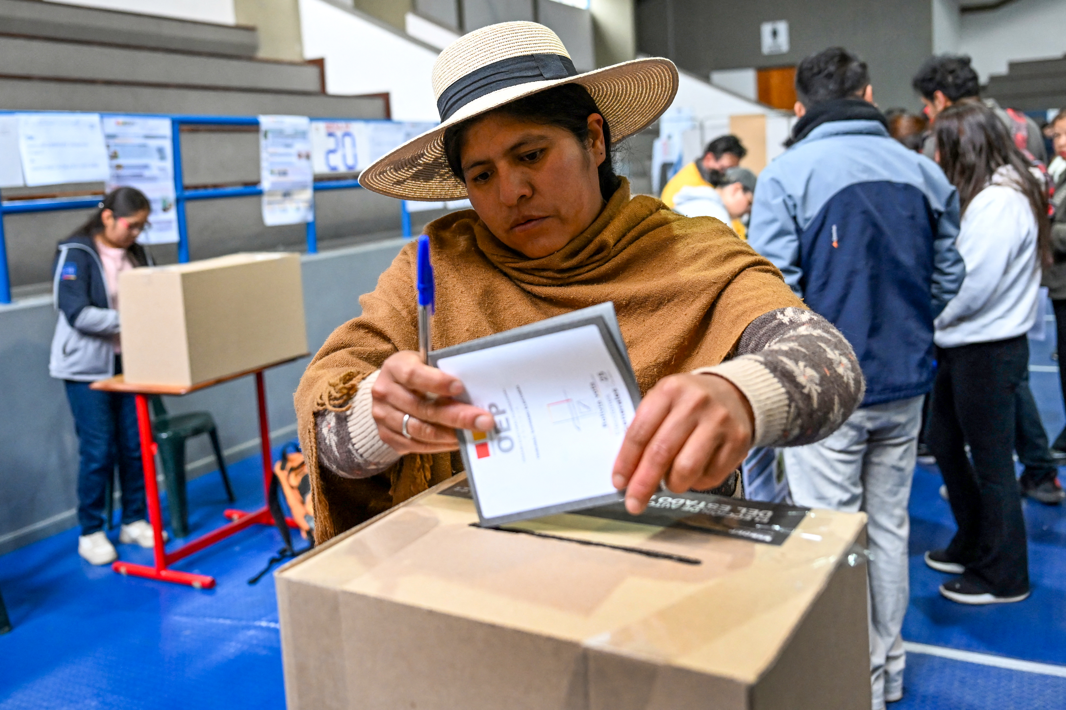 A woman casts her vote at a polling station during the presidential election in La Paz