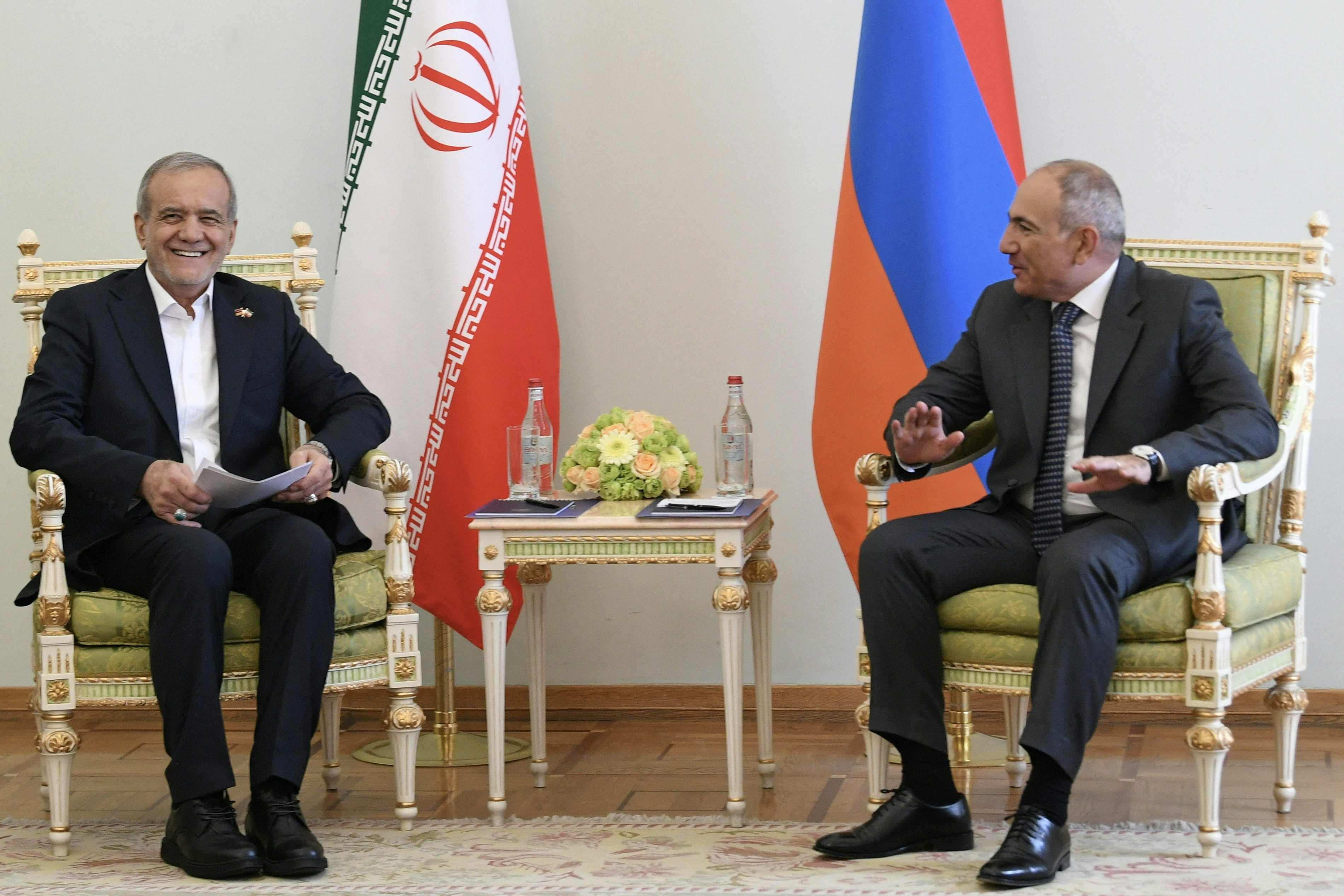 Armenia's Prime Minister Nikol Pashinyan (R) welcomes Iran's President Masoud Pezeshkian in Yerevan, Armenia on August 19, 2025.