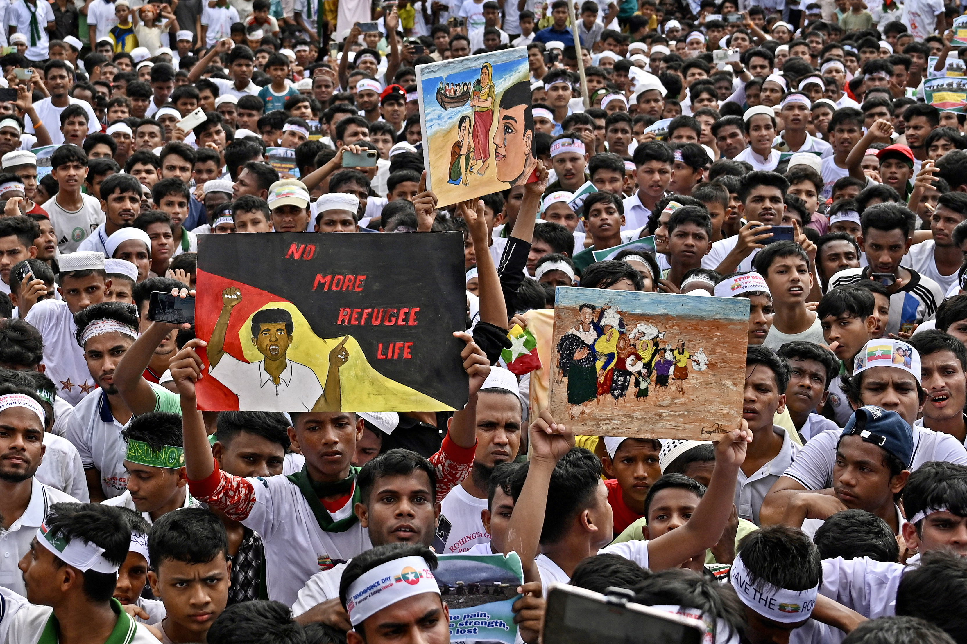 Rohingya refugees take part in the 'Genocide Remembrance Day' rally to mark the anniversary of their mass exodus from Myanmar