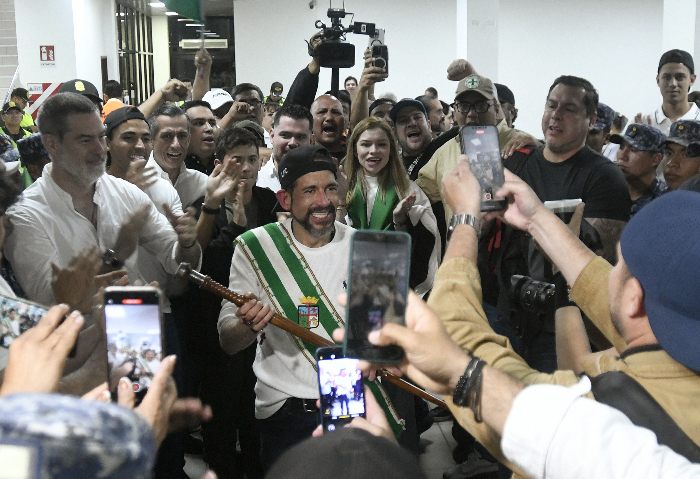 Right-wing political leader Luis Fernando Camacho smiles after his arrival at the airport in Santa Cruz, Bolivia on August 29, 2025.