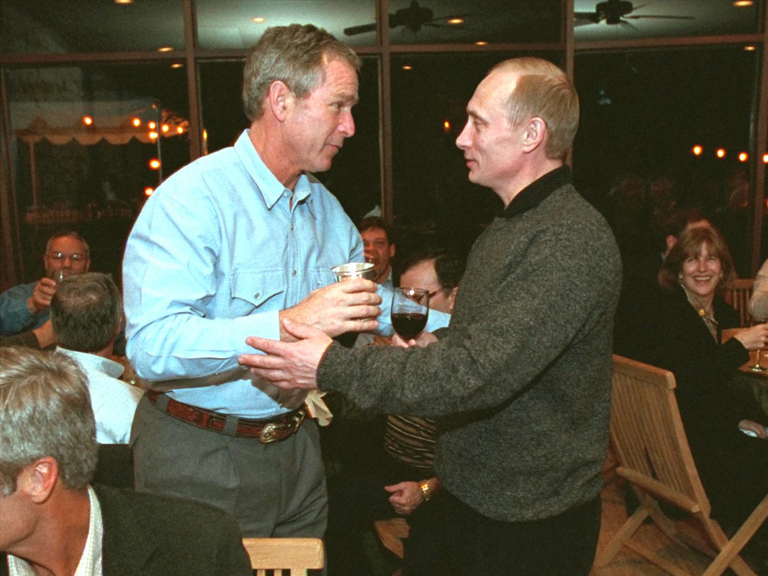 George W. Bush and Vladimir Putin during a toast at Bush ranch, Crawford, Texas, photo