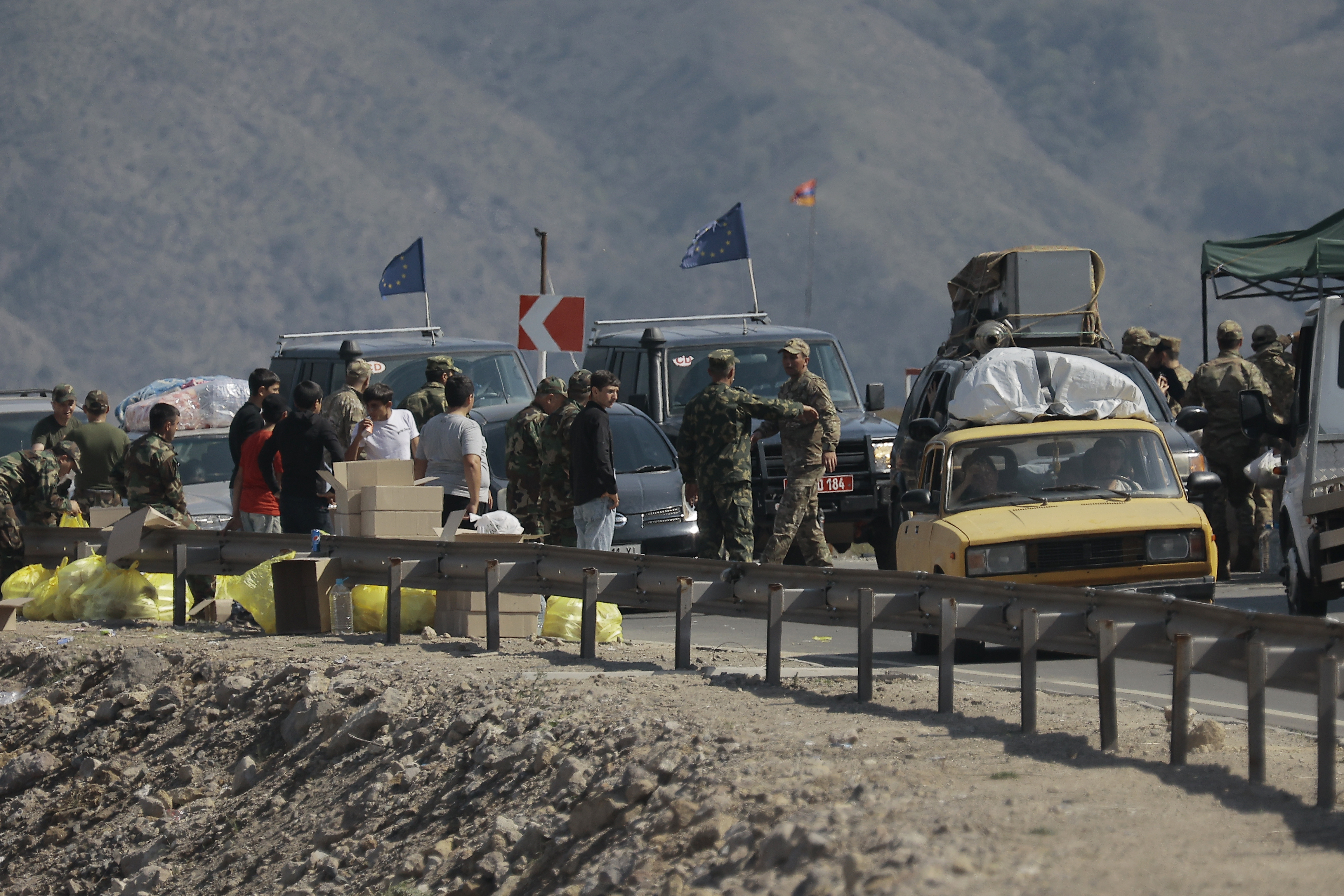 Vehicles carrying refugees from Nagorno-Karabakh queue on the road leading towards the Armenian border, in Nagorno-Karabakh