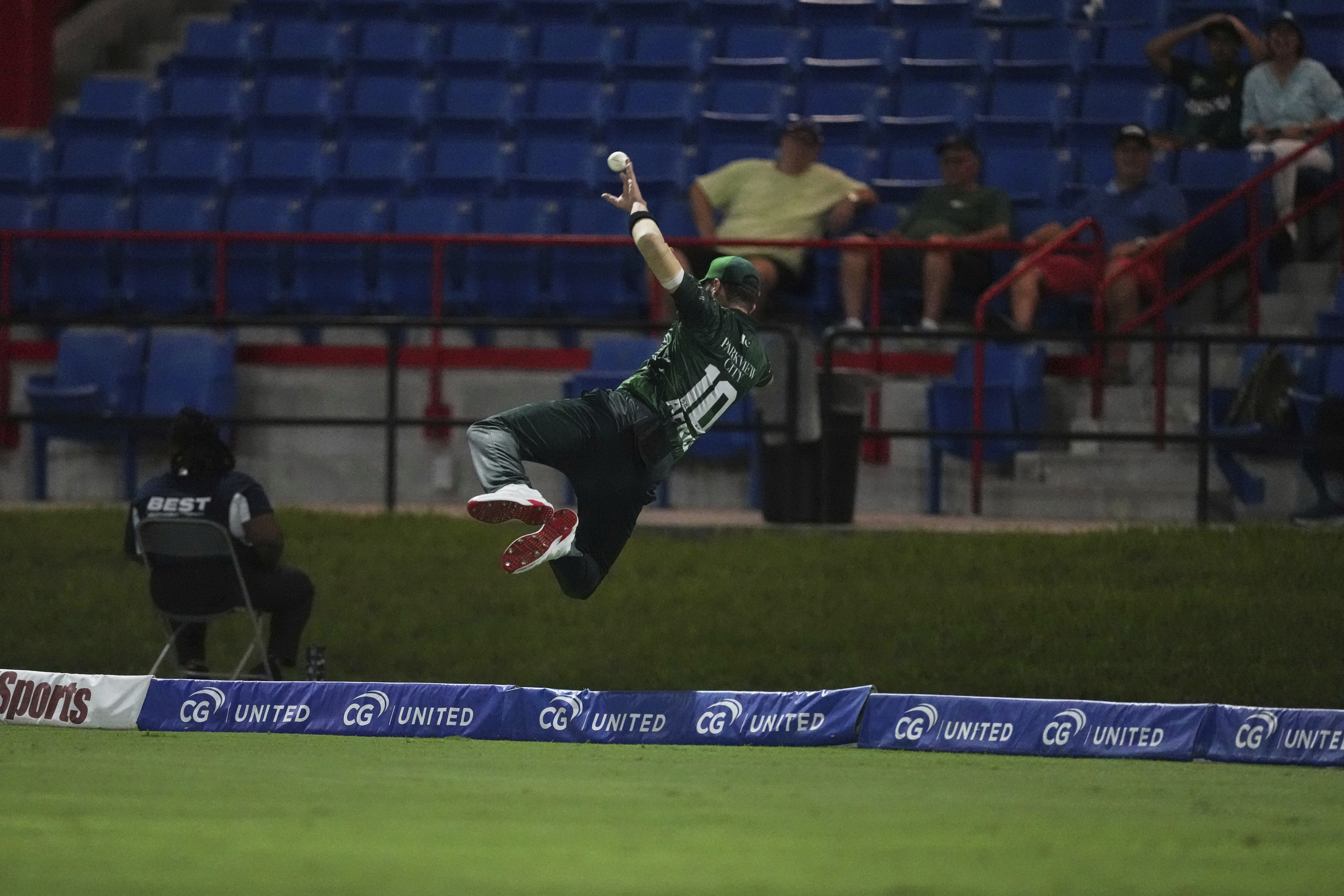 Pakistan's Shaheen Shah Afridi attempts to take catch of West Indies' Johnson Charles on the boundary edge during the first Twenty20