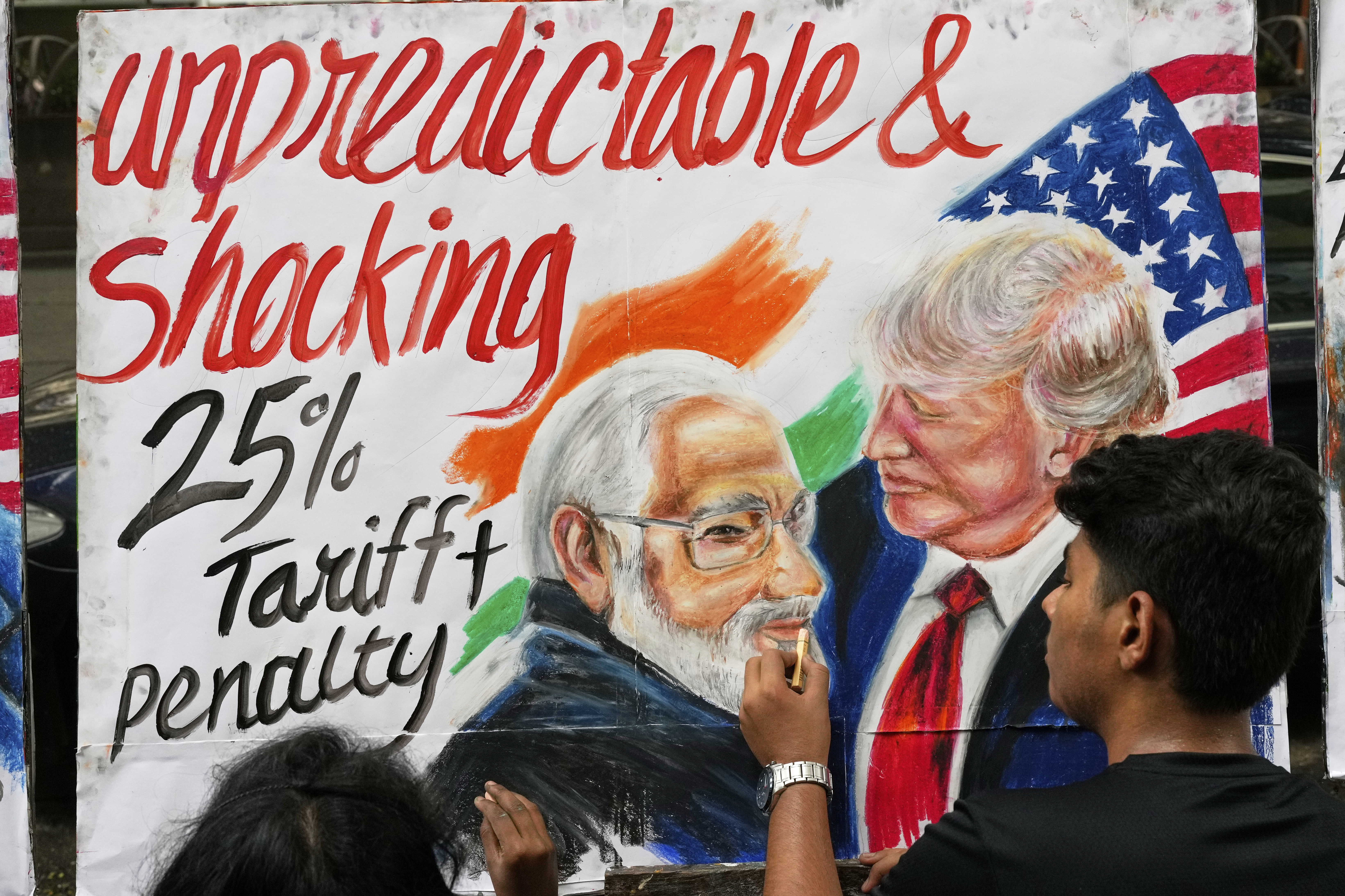 A student of Gurukul school of Art completes artwork of US President Donald Trump and Prime Minister of India Narendra Modi, in Mumbai, India, Friday, Aug. 1, 2025. [Rajanish Kakade/AP]