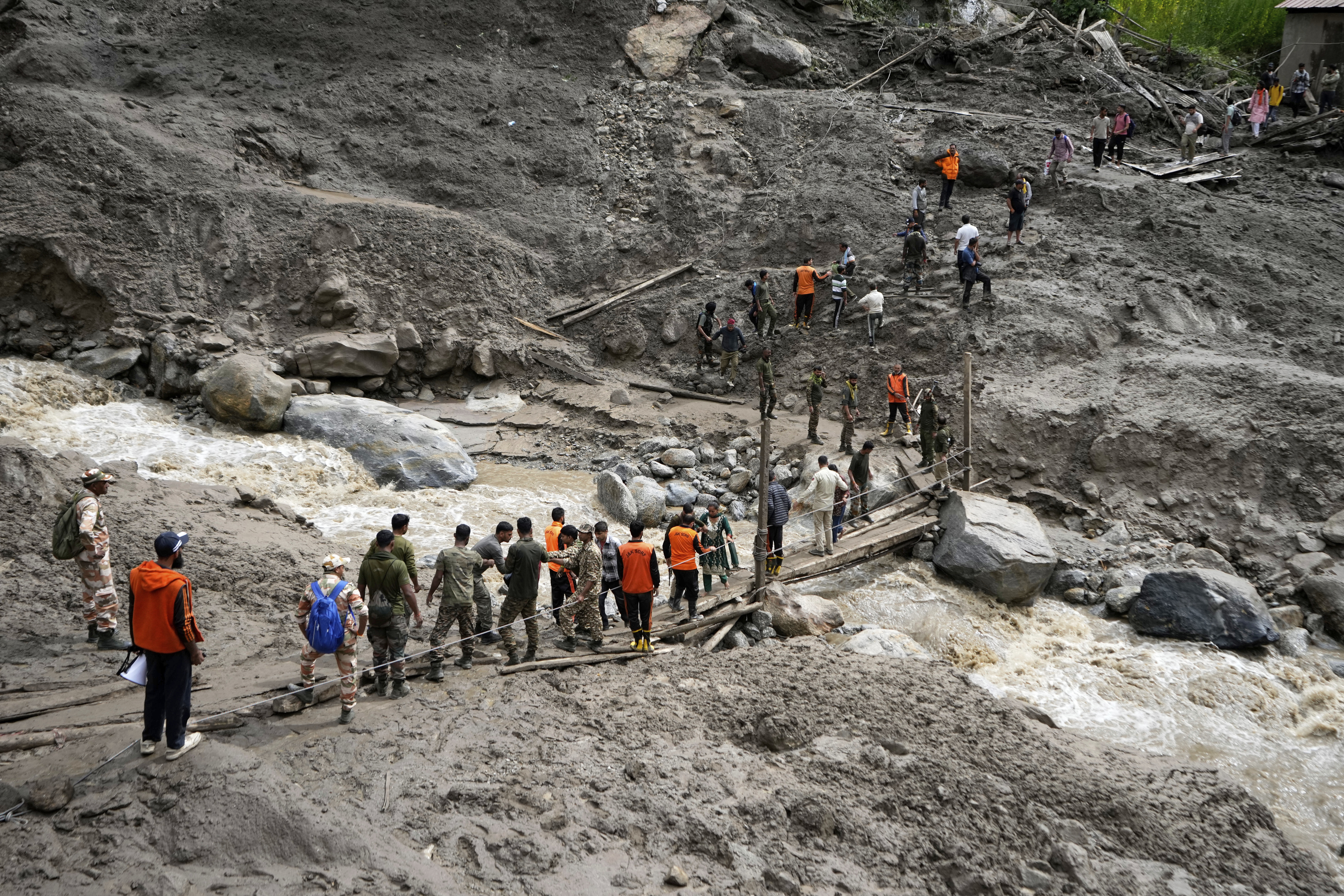 Rescuers search for missing flash flood victims in remote Kashmir village
