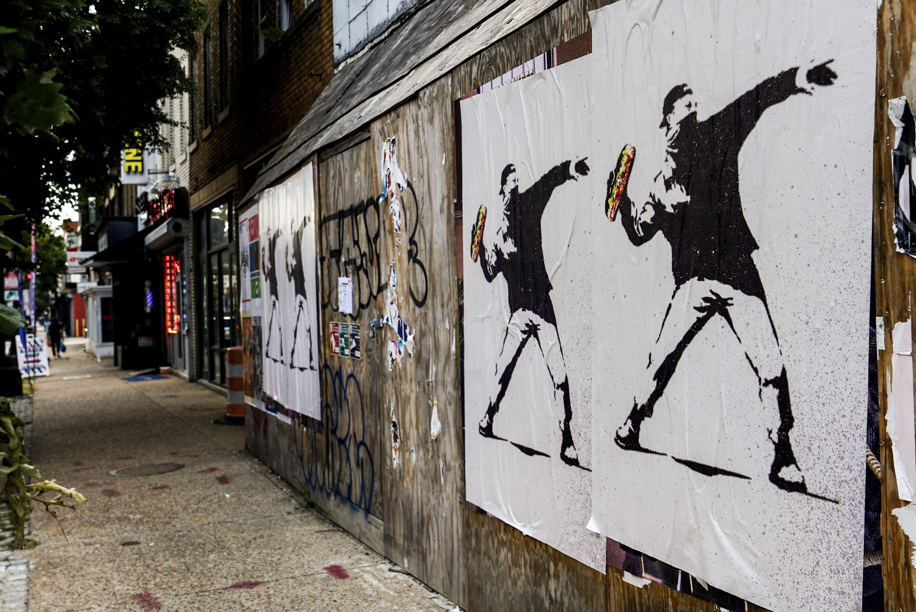 Posters in Washington, DC, depict a man arrested for throwing a sandwich at a federal officer last year, who became a symbol of local resistance to federal law enforcement in the city