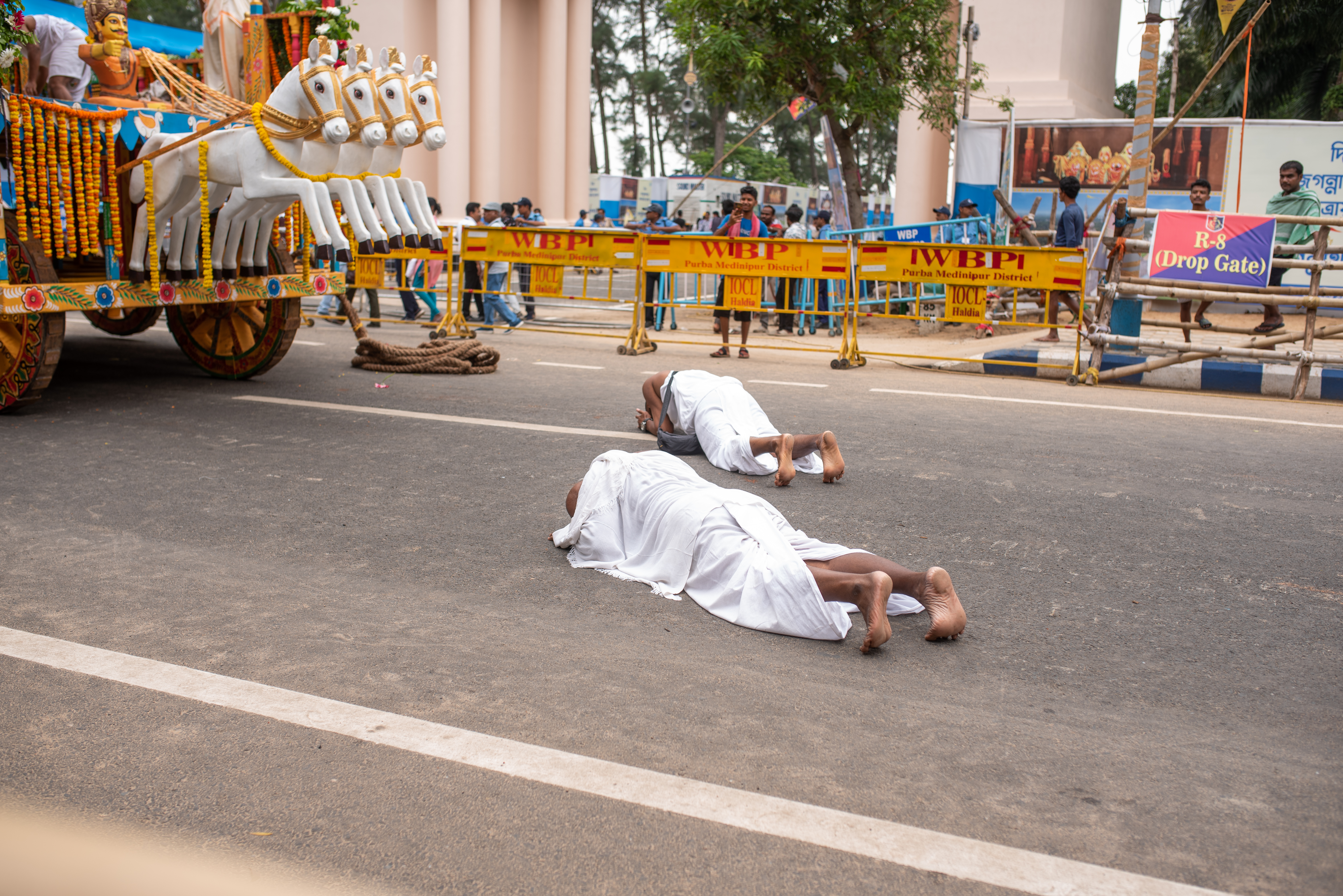Digha, West Bengal, India; 5th May, 2025 — Two devotees from ISKON (The International Society for Krishna Consciousness), praying in front of the Rath (Chariot), on the final day of Rath Yatra.