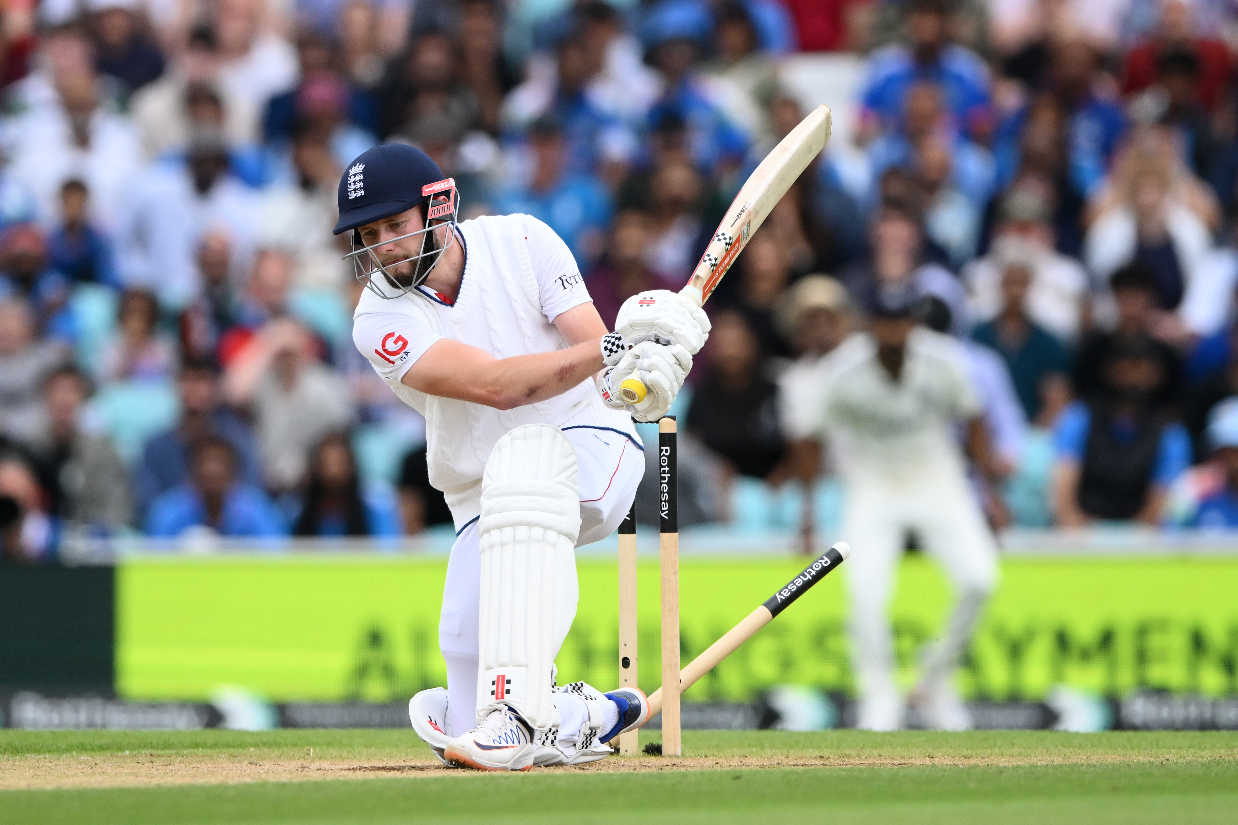 Gus Atkinson of England is bowled by Mohammed Siraj of India on day five of the 5th Rothesay Test Match at The Kia Oval
