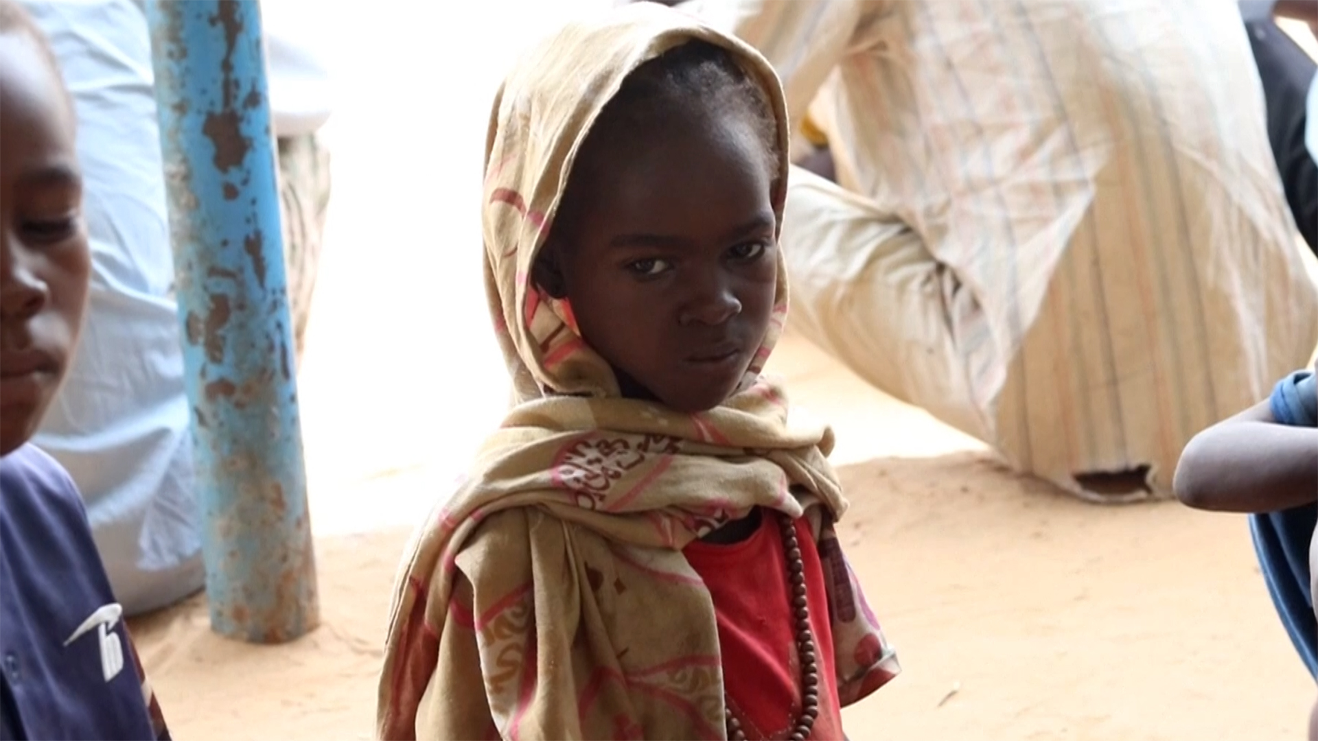 A Sudanese child looks towards the viewer.