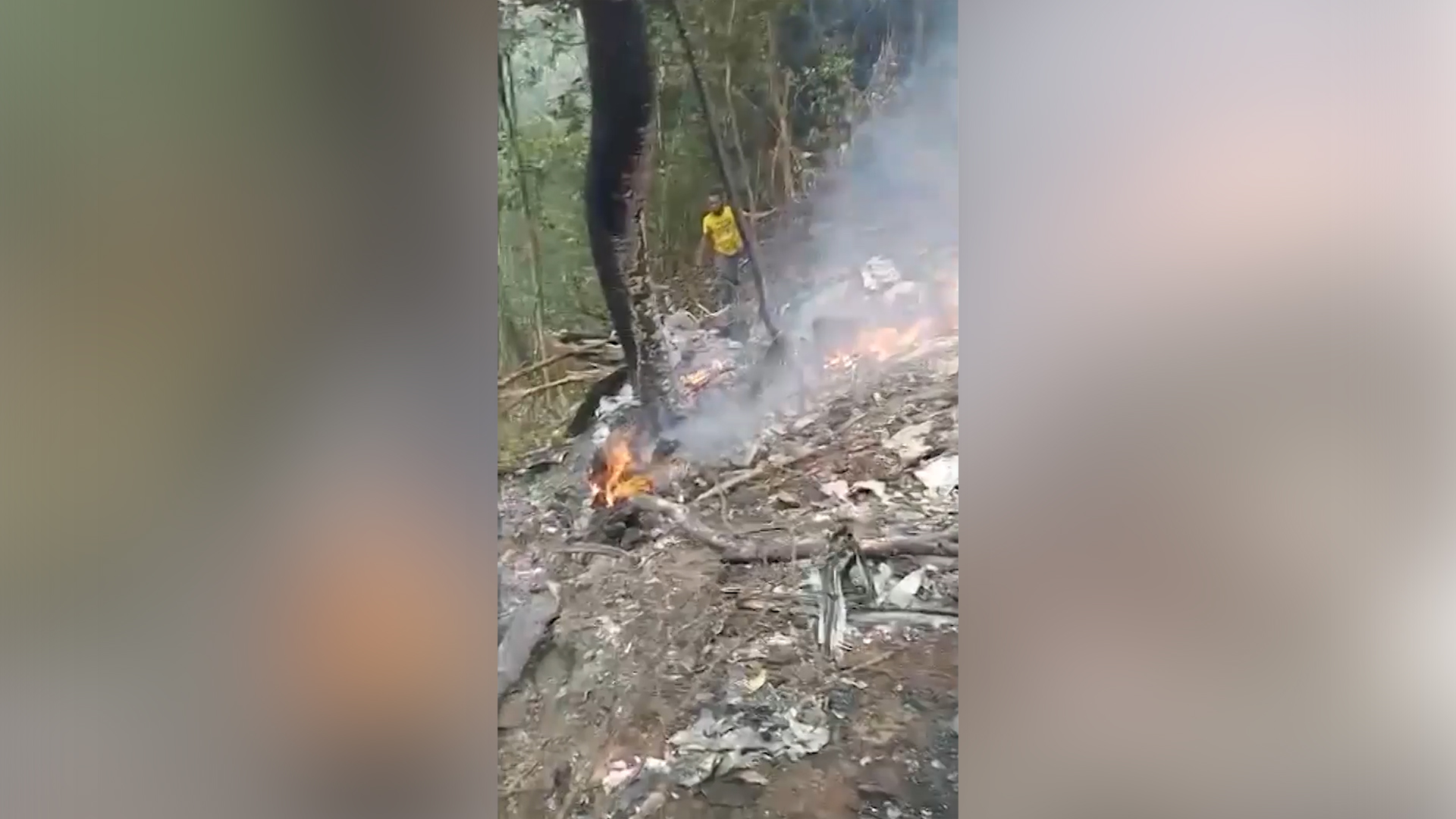 Footage from a forest in Ghana&rsquo;s Ashanti region showed smouldering wreckage from a helicopter crash that killed the country's defence and environment ministers. [Joy TV via Reuters] (Reuters)