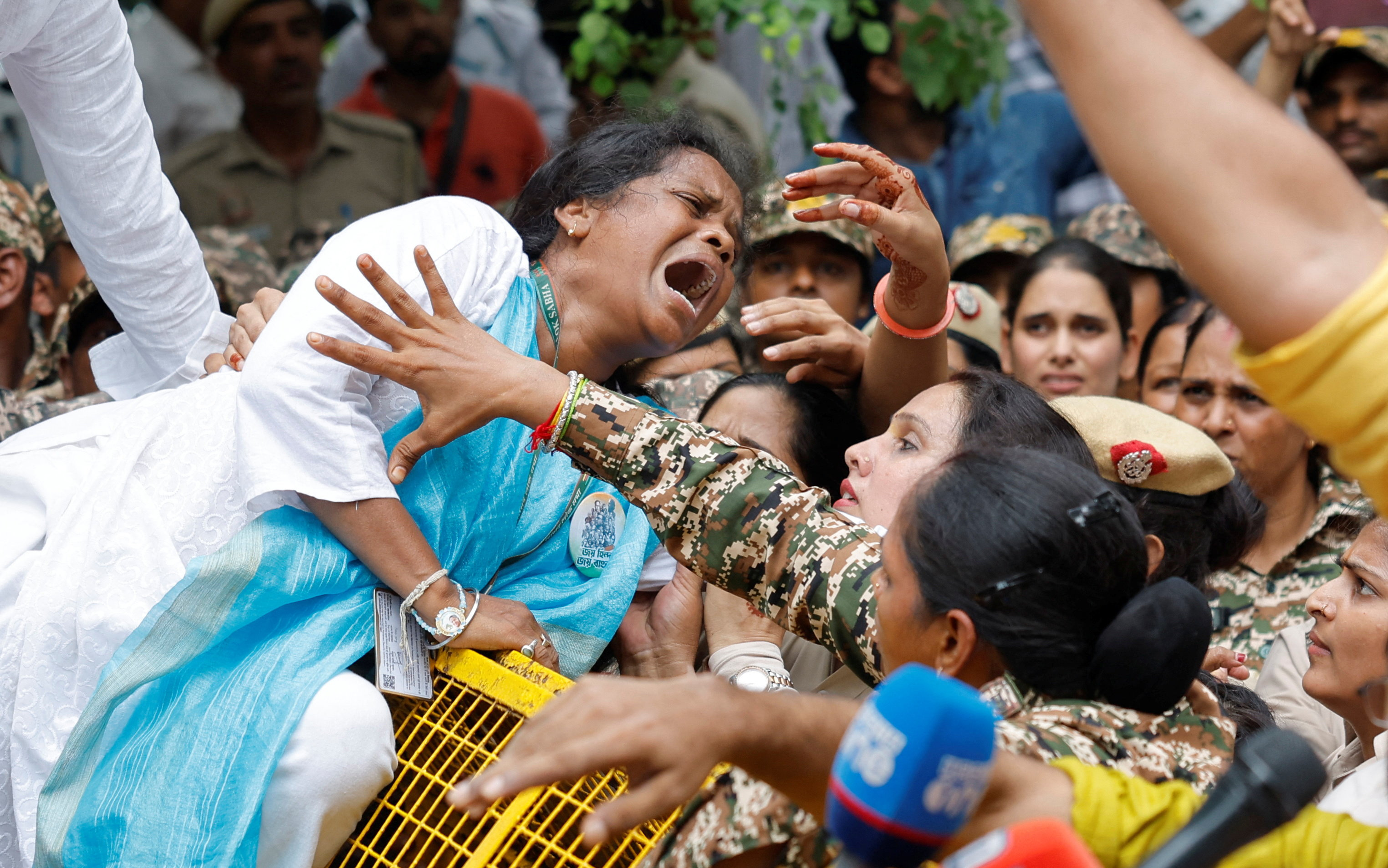 An Indian opposition lawmaker reacts as she tries to cross a police barricade during a protest against what they say are electoral malpractices, in New Delhi, India, August 11, 2025. REUTERS/Adnan Abidi