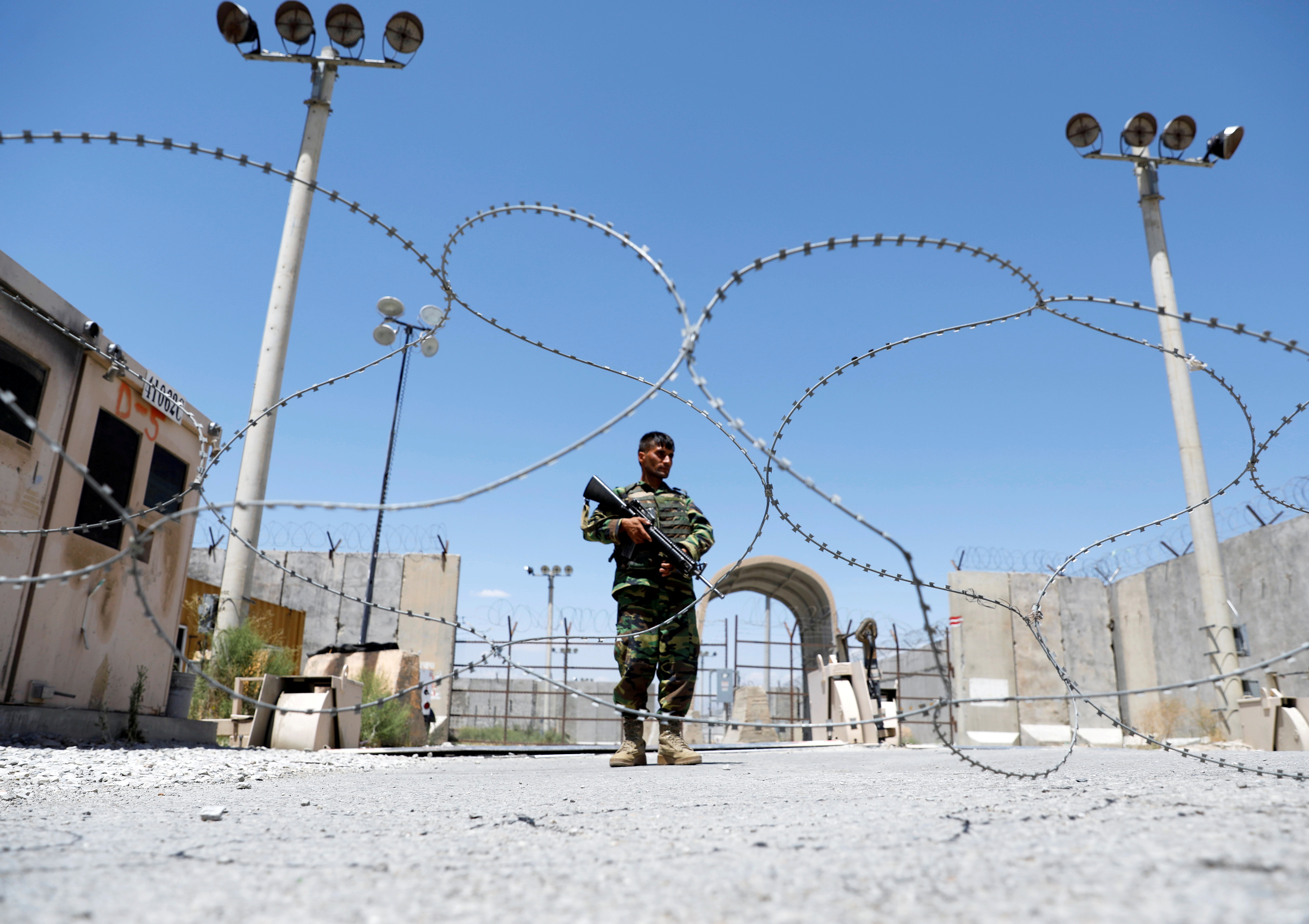 An Afghan soldier at the gate of Bagram US airbase in Parwan province
