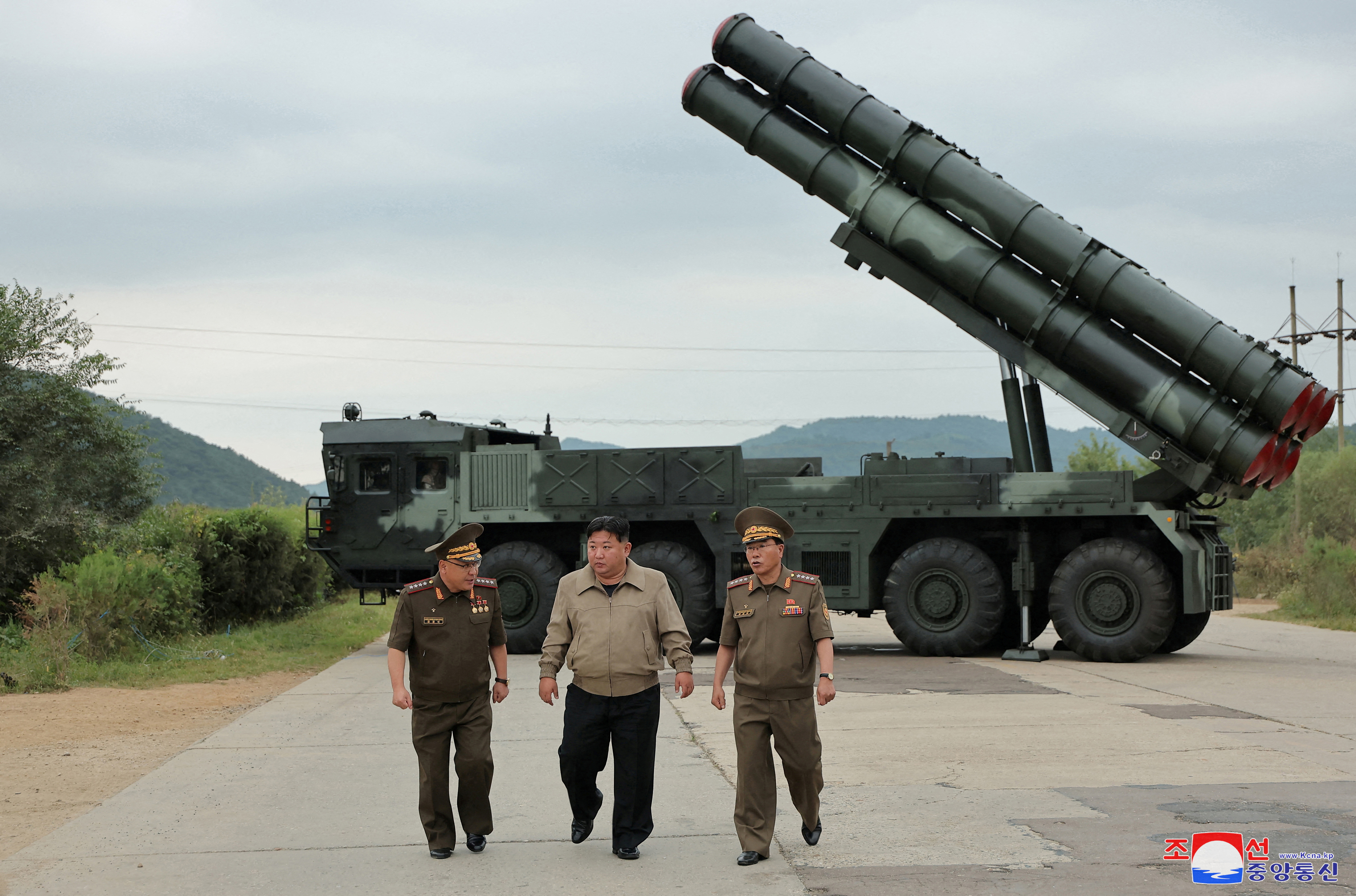 North Korean leader Kim Jong Un oversees a test-fire for a new rocket launcher.