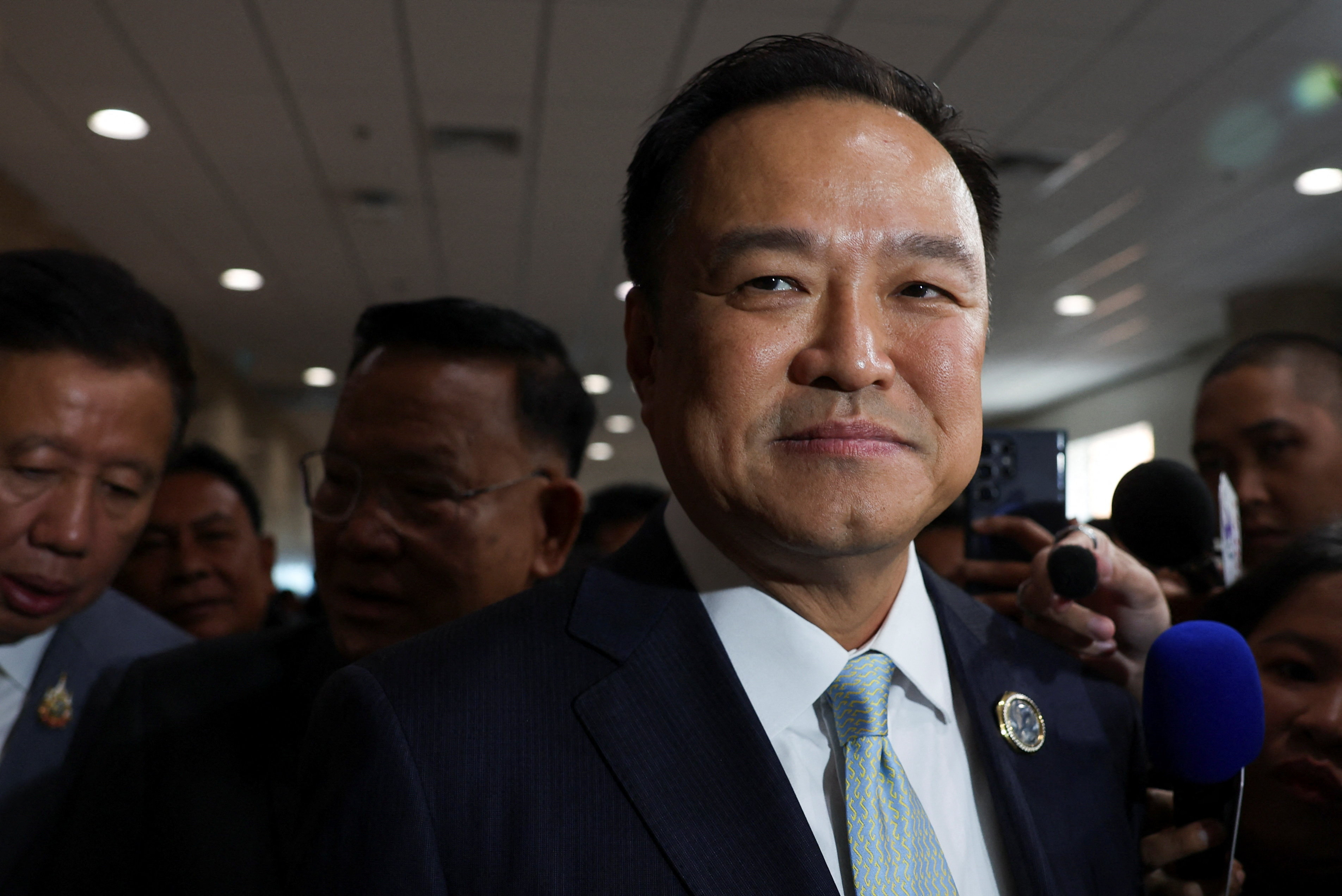 Anutin Charnvirakul, Bhumjaithai Party's leader and prime ministerial candidate, leaves after a press conference at the parliament, as the People's Party announced it will back the Bhumjaithai Party to form a government, following the Constitutional Court's removal of Prime Minister Paetongtarn Shinawatra from office for an ethics violation, in Bangkok, Thailand, September 3, 2025. REUTERS/Chalinee Thirasupa