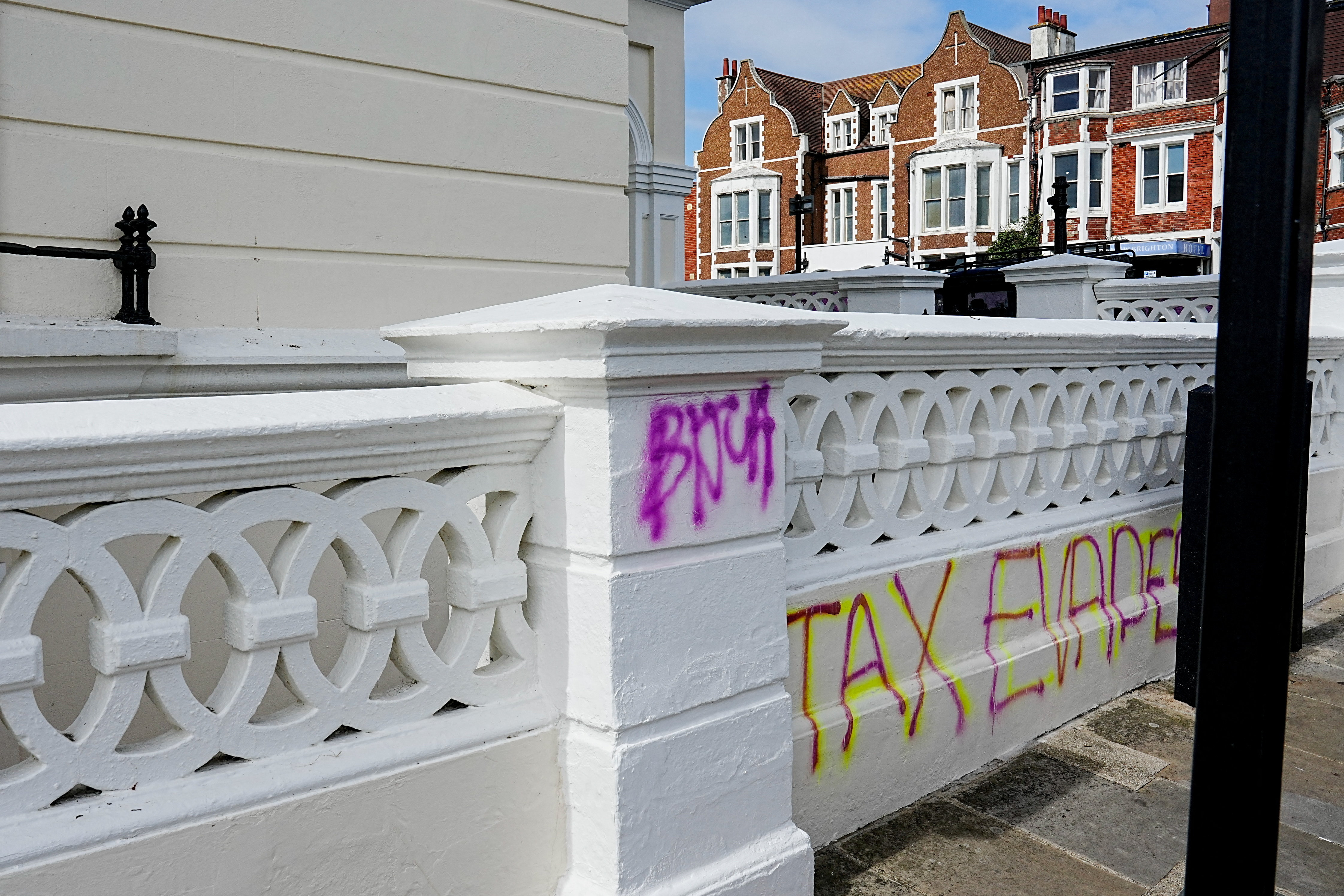 Graffiti reads "tax evader" outside British Deputy Prime Minister Angela Rayner's second property, a day after she admitted underpaying stamp duty for its purchase and referred herself to the ethics watchdog, in Hove, Britain, September 4, 2025. REUTERS/Carlos Jasso