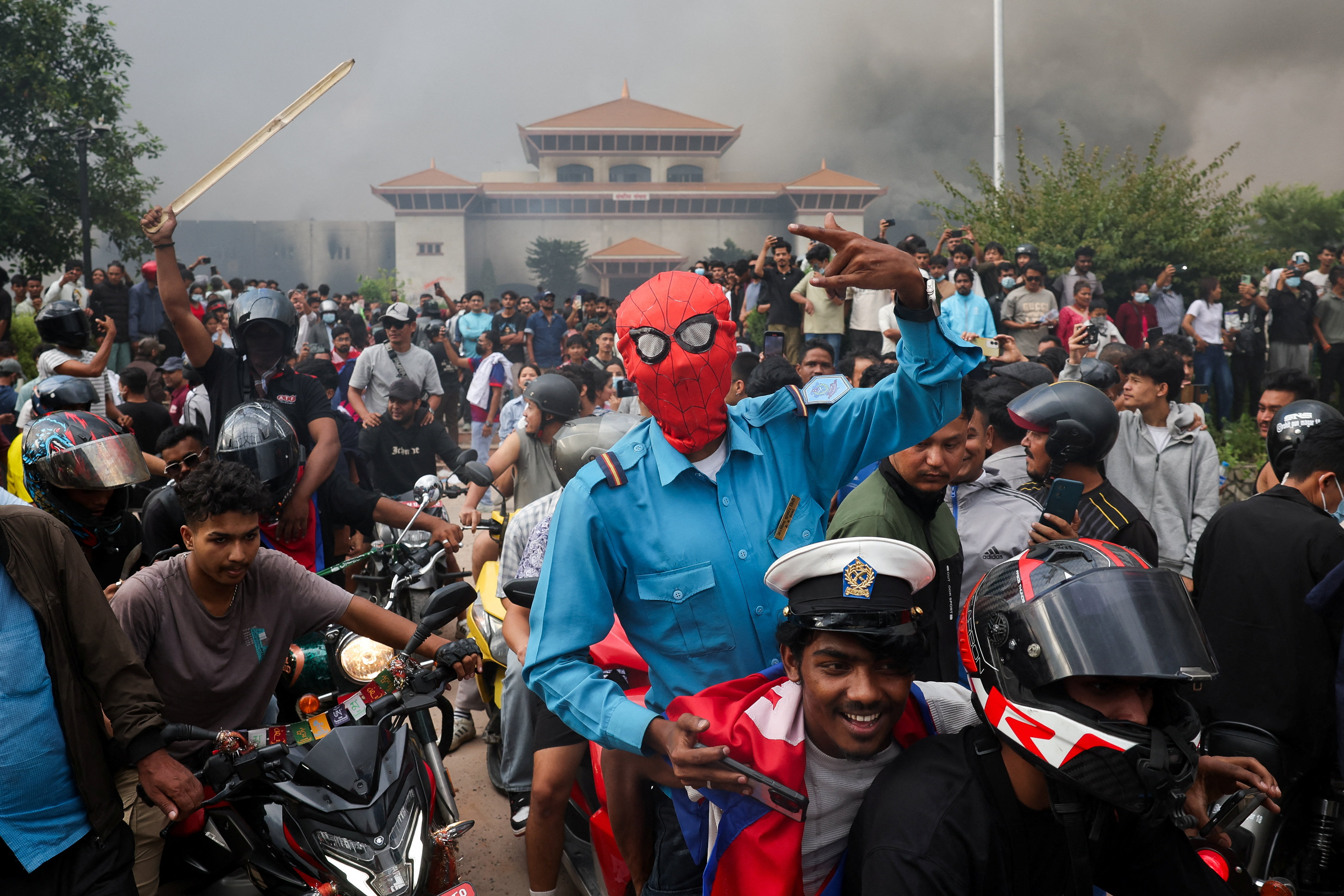 Protesters torch Nepal parliament as PM resigns amid turmoil