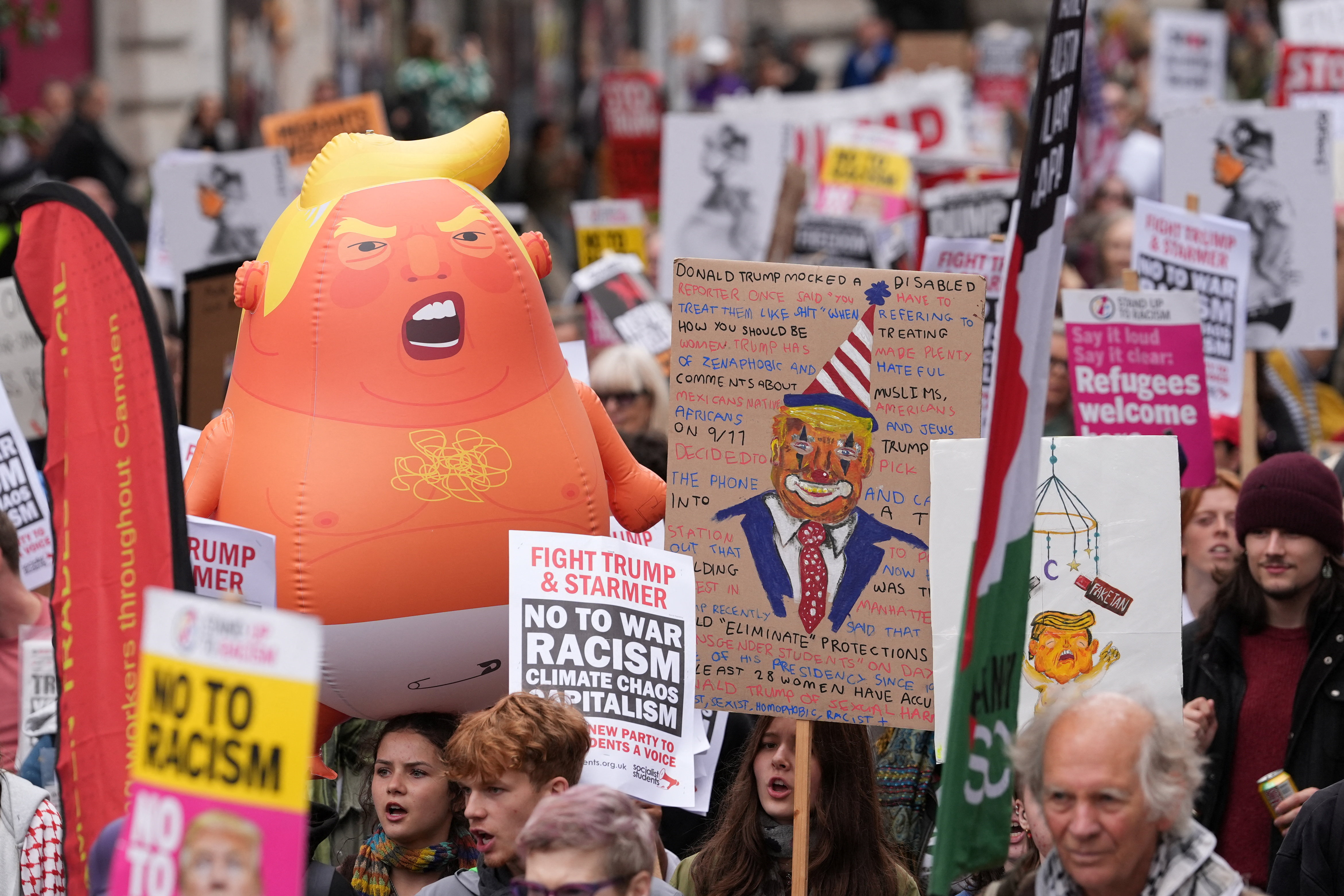 People hold an inflatable doll depicting U.S. President Donald Trump during a 'Trump Not Welcome' protest and rally during the state visit of U.S. President Donald Trump and first lady Melania Trump, in London, Britain, September 17, 2025. [Maja Smiejkowska, REUTERS]