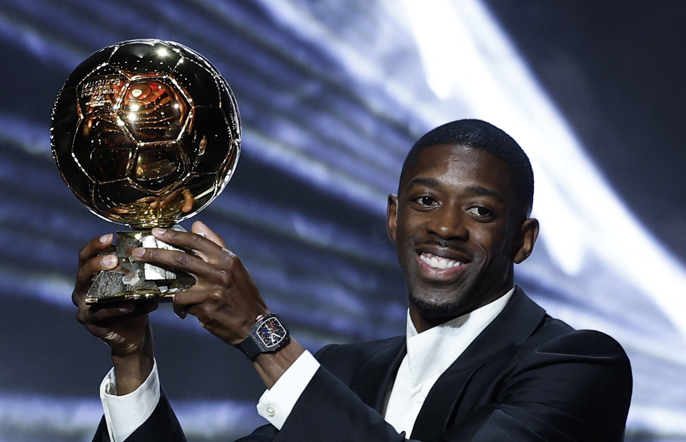 Paris Saint-Germain's Ousmane Dembele celebrates after winning the men's Ballon d'Or award