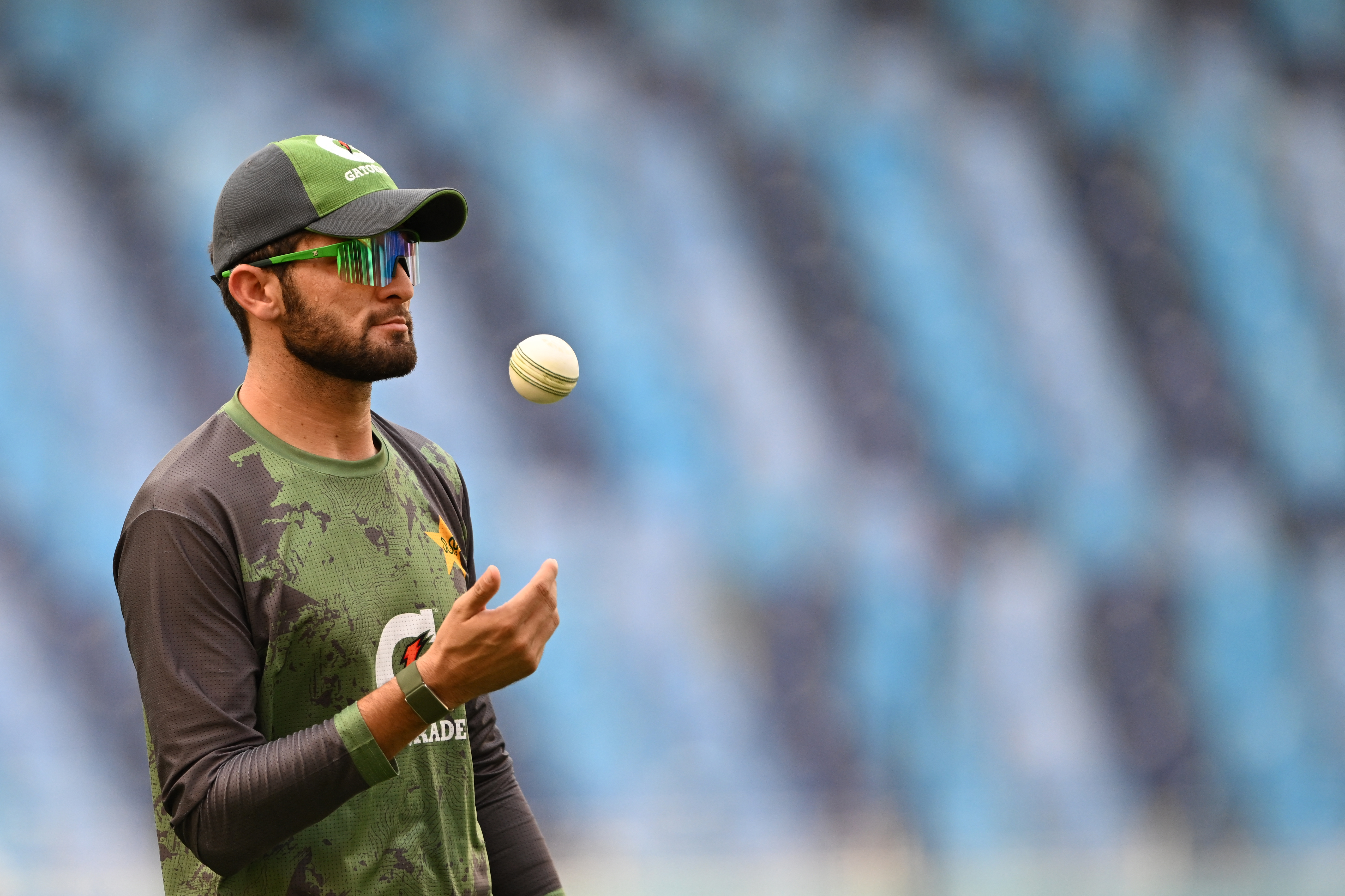Pakistan's Shaheen Shah Afridi tosses a ball before the start of the Asia Cup 2025 Twenty20 international cricket match between Oman and Pakistan at the Dubai International Stadium in Dubai on September 12, 2025. (Photo by Sajjad HUSSAIN / AFP)