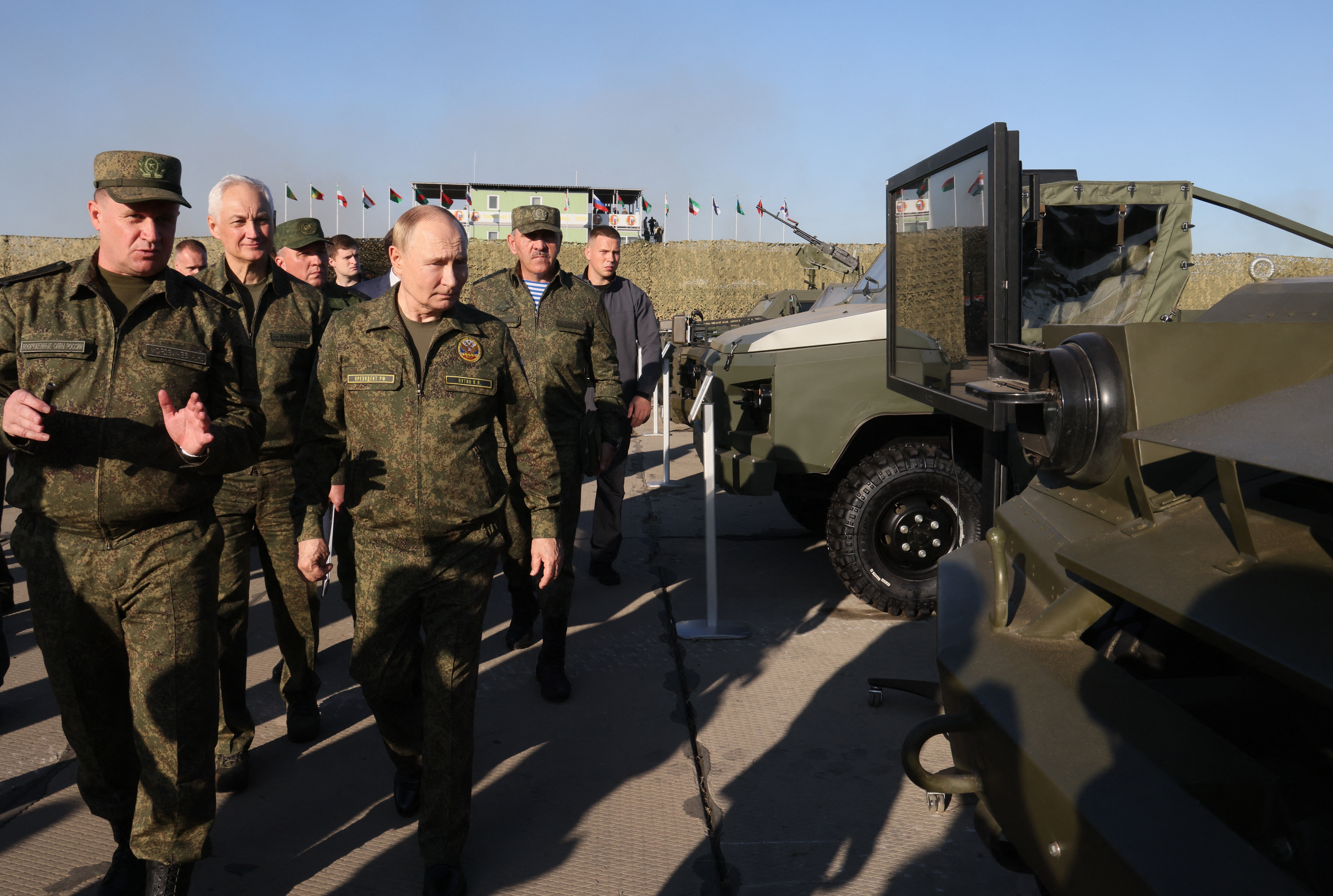 In this pool photograph distributed by the Russian state agency Sputnik, Russia's President Vladimir Putin tours an exhibition of military equipment while inspecting the "Zapad-2025" (West-2025) joint Russian-Belarusian military drills at a training ground in the Nizhny Novgorod Oblast on September 16, 2025. (Photo by Mikhail METZEL / POOL / AFP)