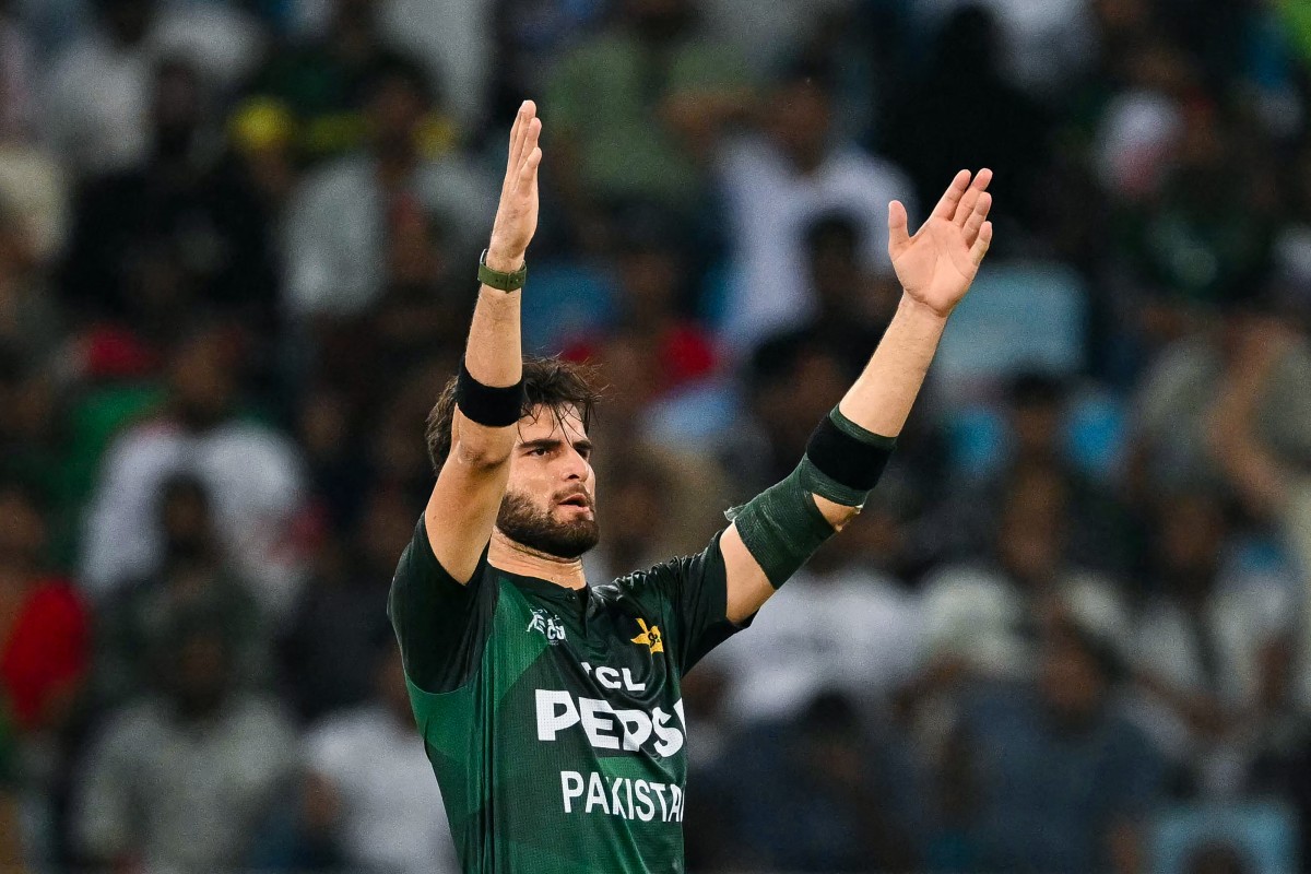 Pakistan's Shaheen Shah Afridi celebrates after dismissing Bangladesh's Shamim Hossain during the Asia Cup 2025 Super Four Twenty20 international cricket match between Bangladesh and Pakistan at the Dubai International Stadium in Dubai on September 25, 2025. (Photo by Sajjad HUSSAIN / AFP)
