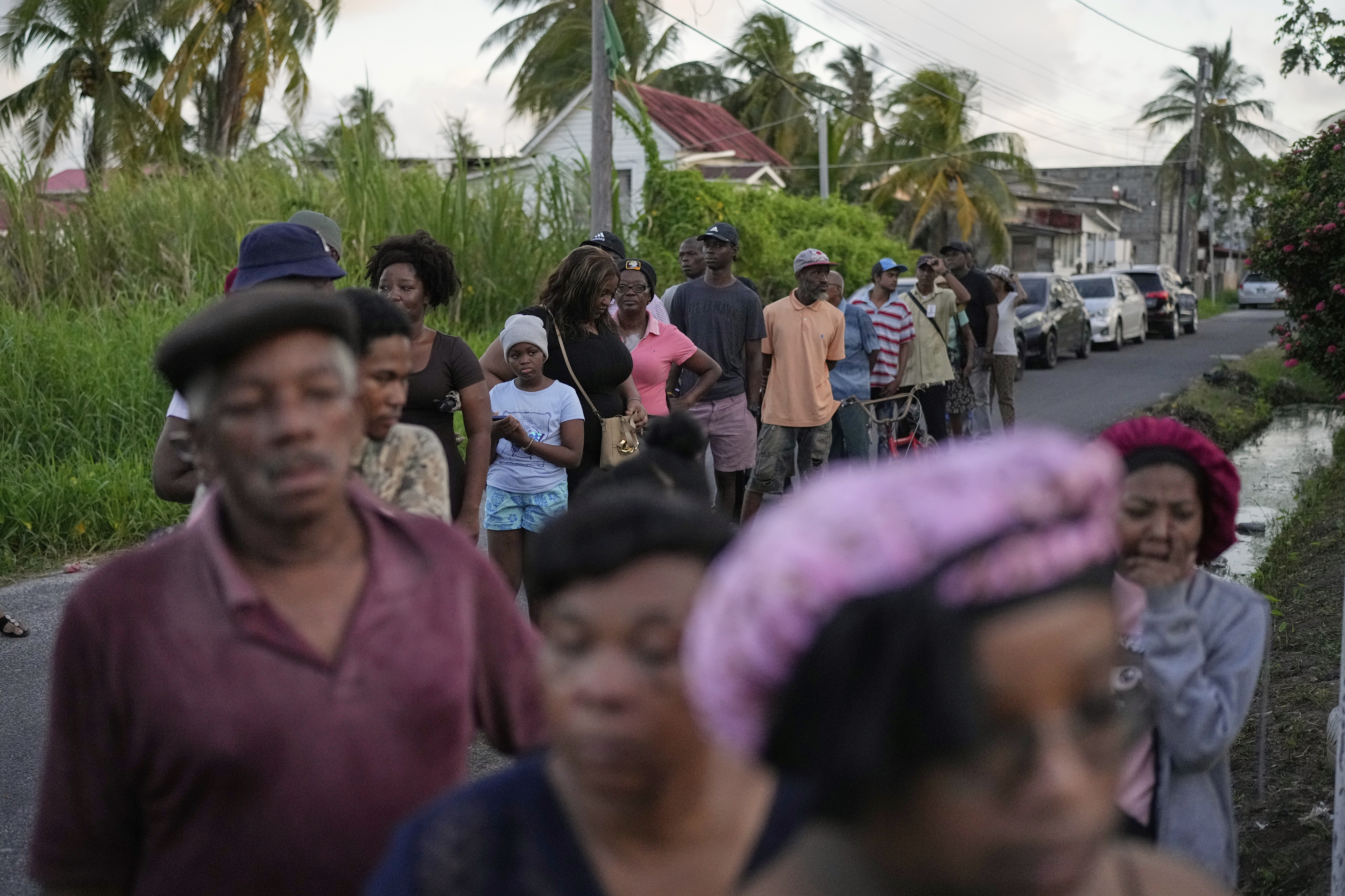 Voters line up at a polling station during general elections in Georgetown, Guyana, Monday, September 1, 2025 [Matias Delacroix/AP]