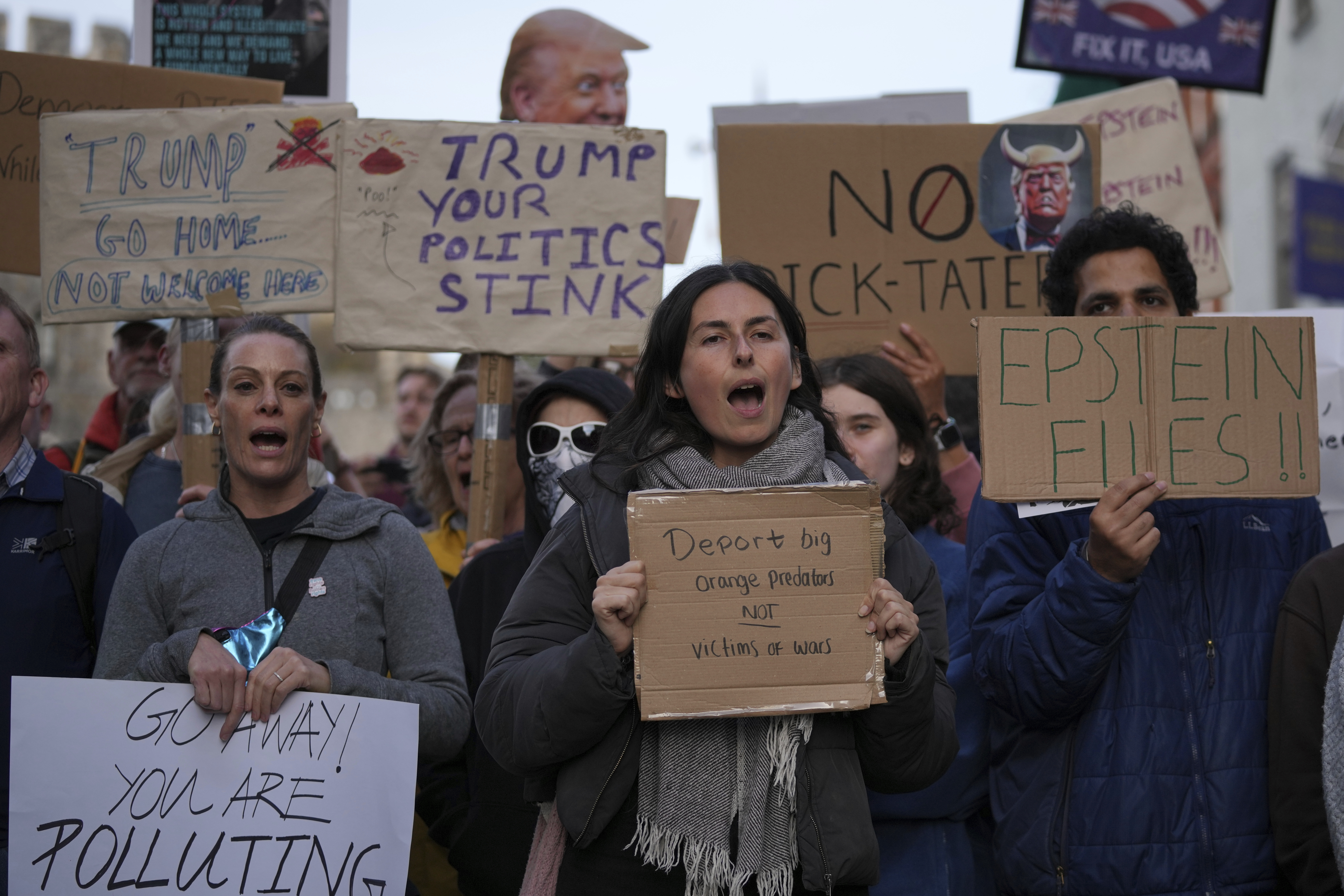Protesters gather for a demonstration ahead of the arrival of President Donald Trump in Windsor, England