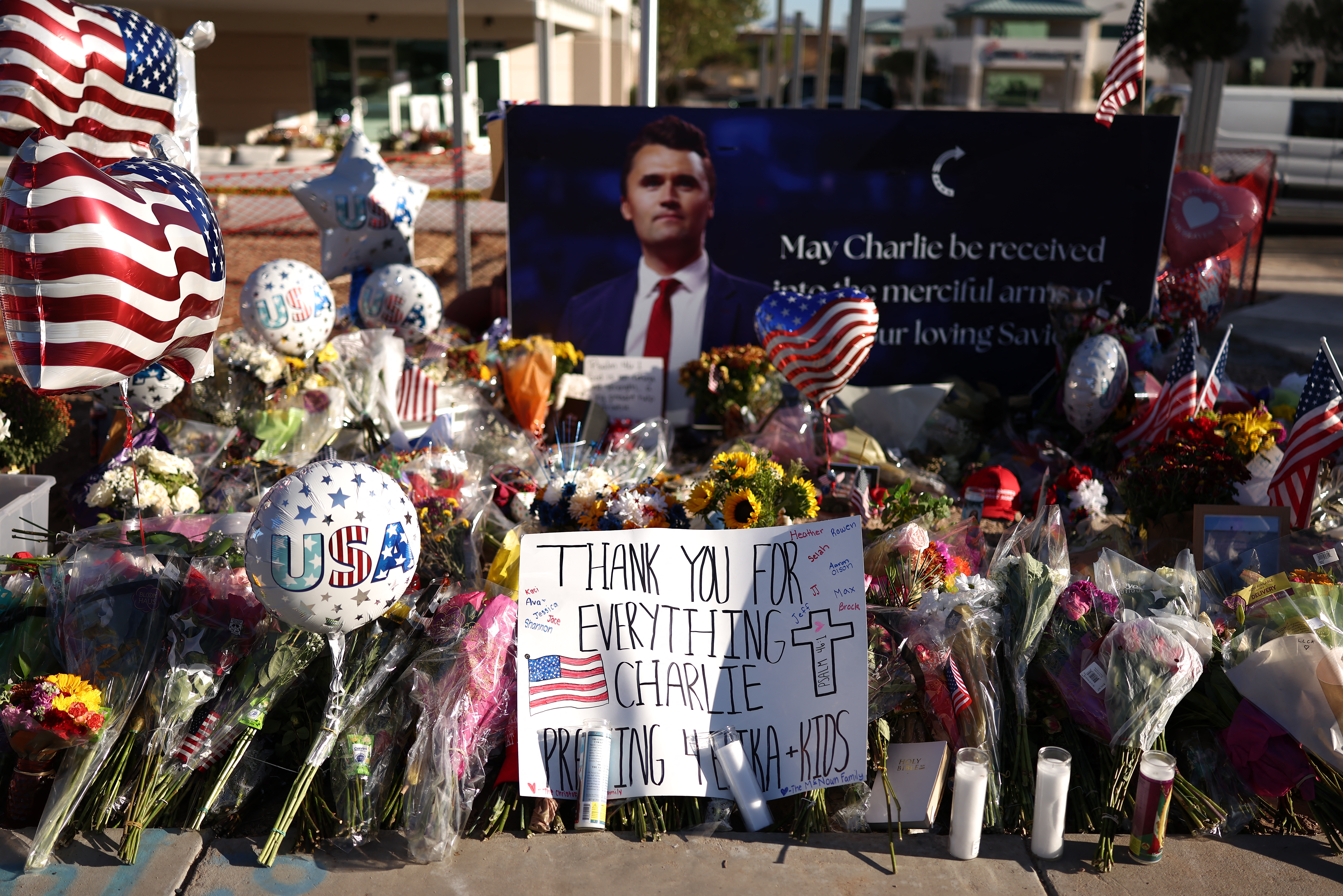 People mourn Charlie Kirk outside of the Turning Point USA headquarters.