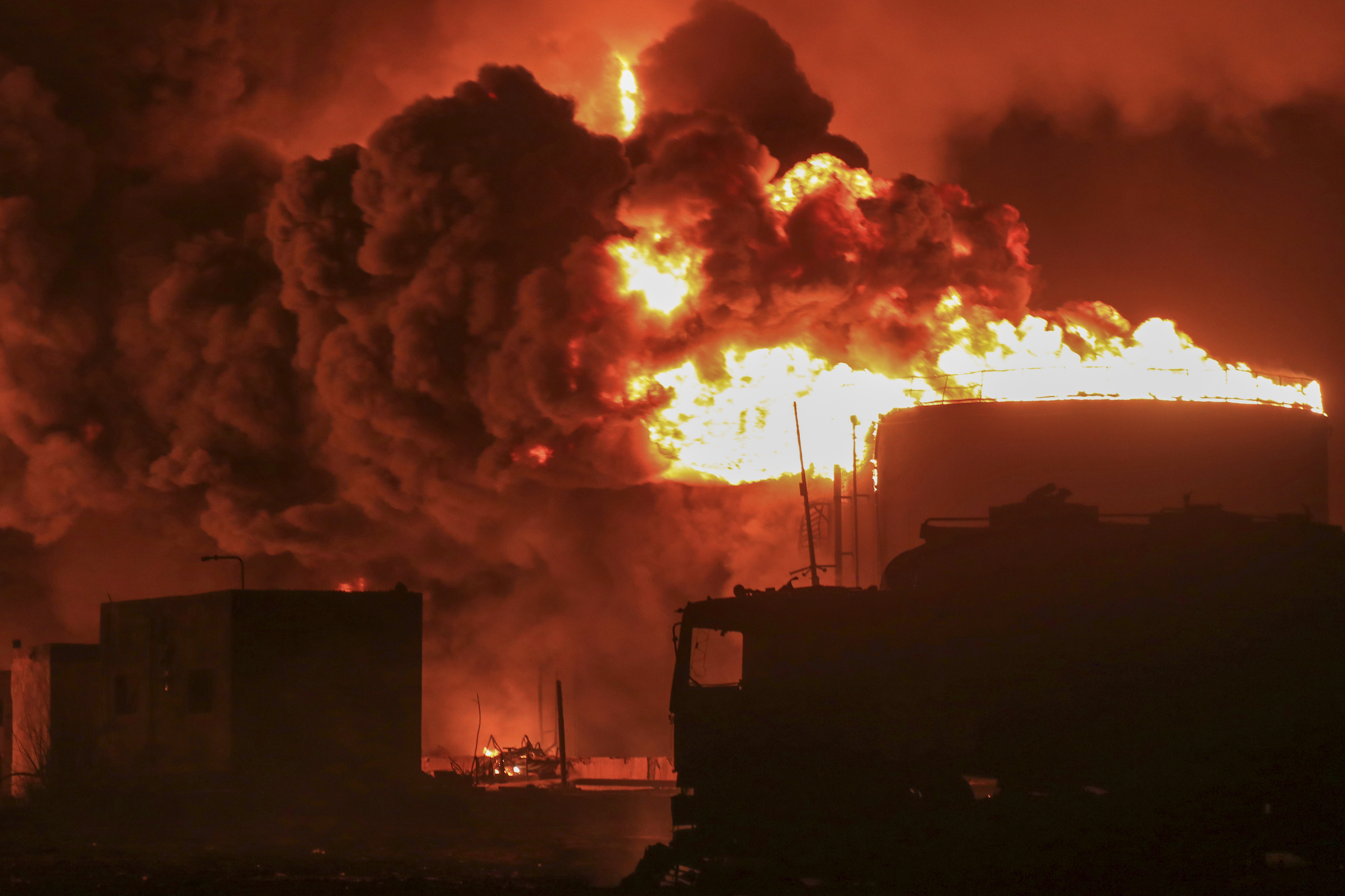 Oil tanks burn at the port in Hodeidah, Yemen, July 20, 2024. The Israeli Army said it has struck several Houthi targets in western Yemen following a fatal drone attack by the rebel group in Tel Aviv the previous day. (AP Photo)
