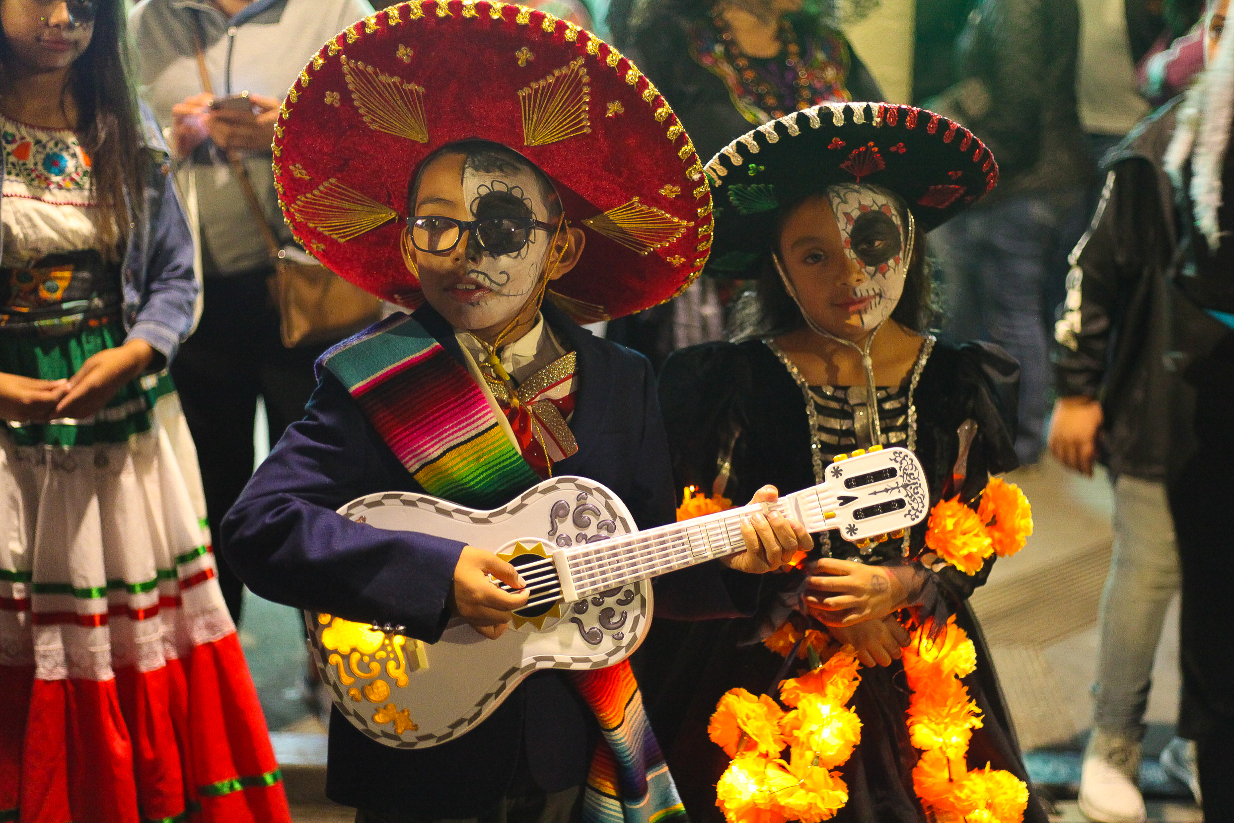 Children dressed as mariachi with Catrina face paint