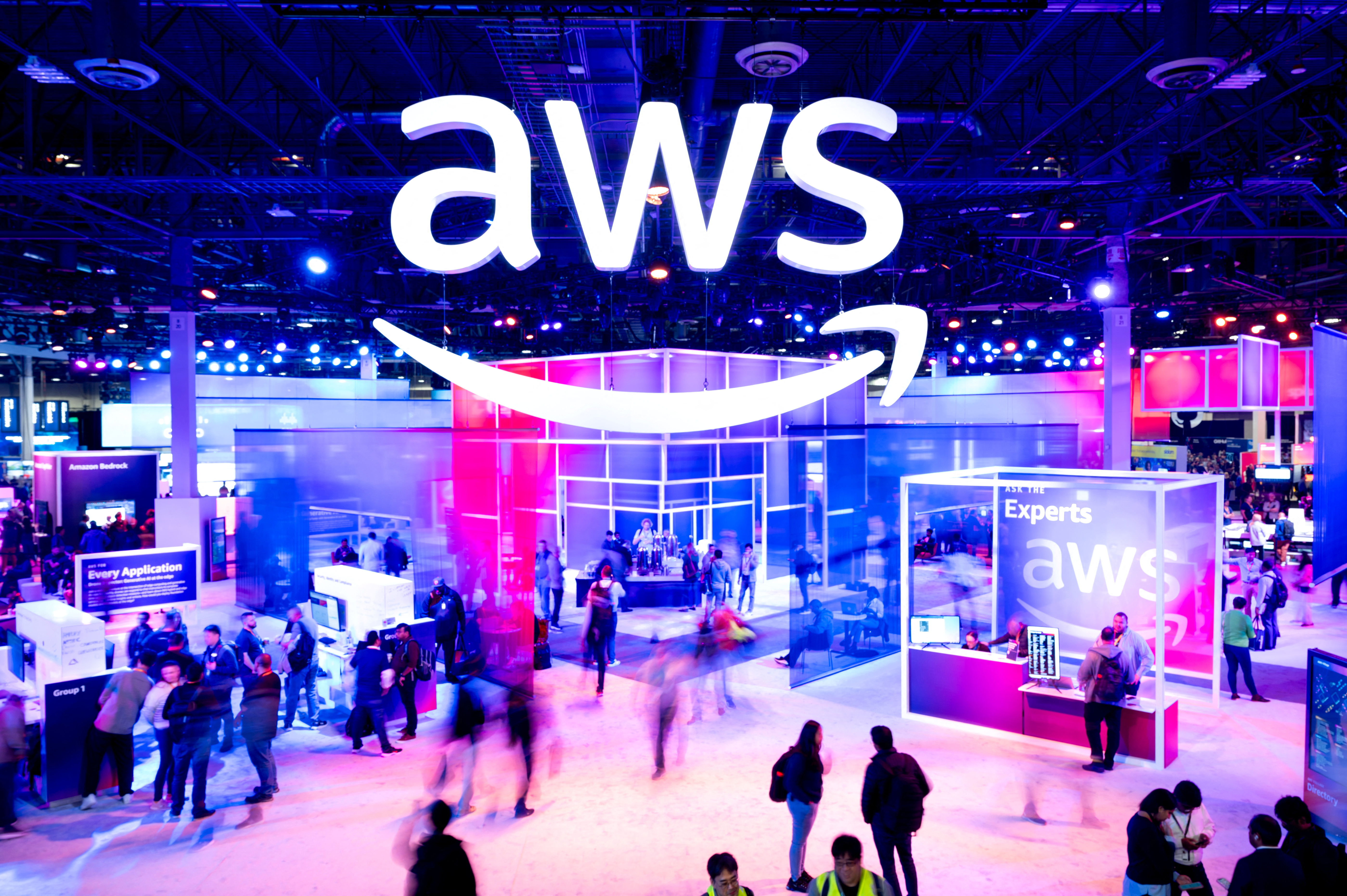 Attendees walk through an expo hall at AWS