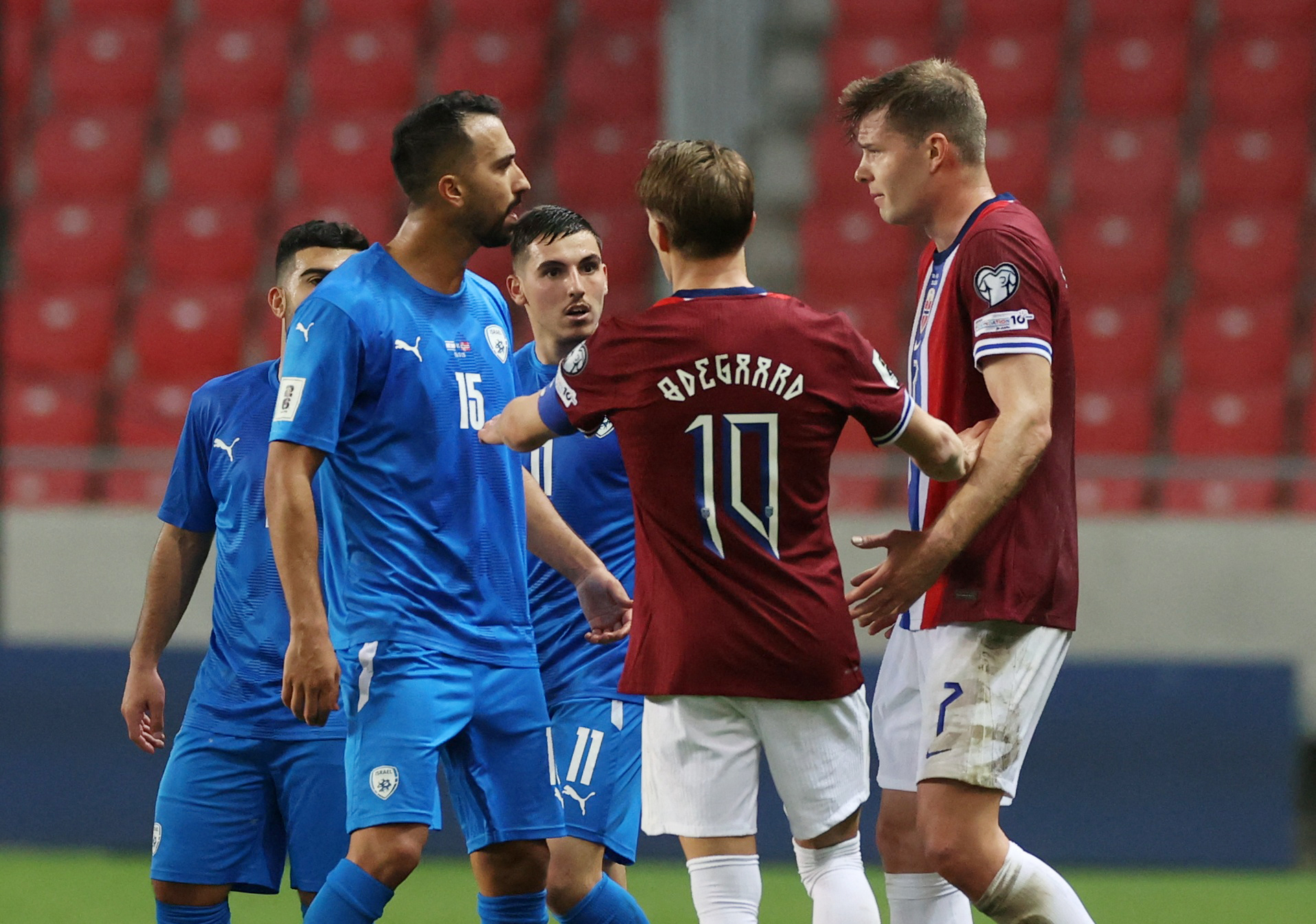 Israel's Eliel Peretz remonstrates with Norway's Alexander Sorloth on the field.