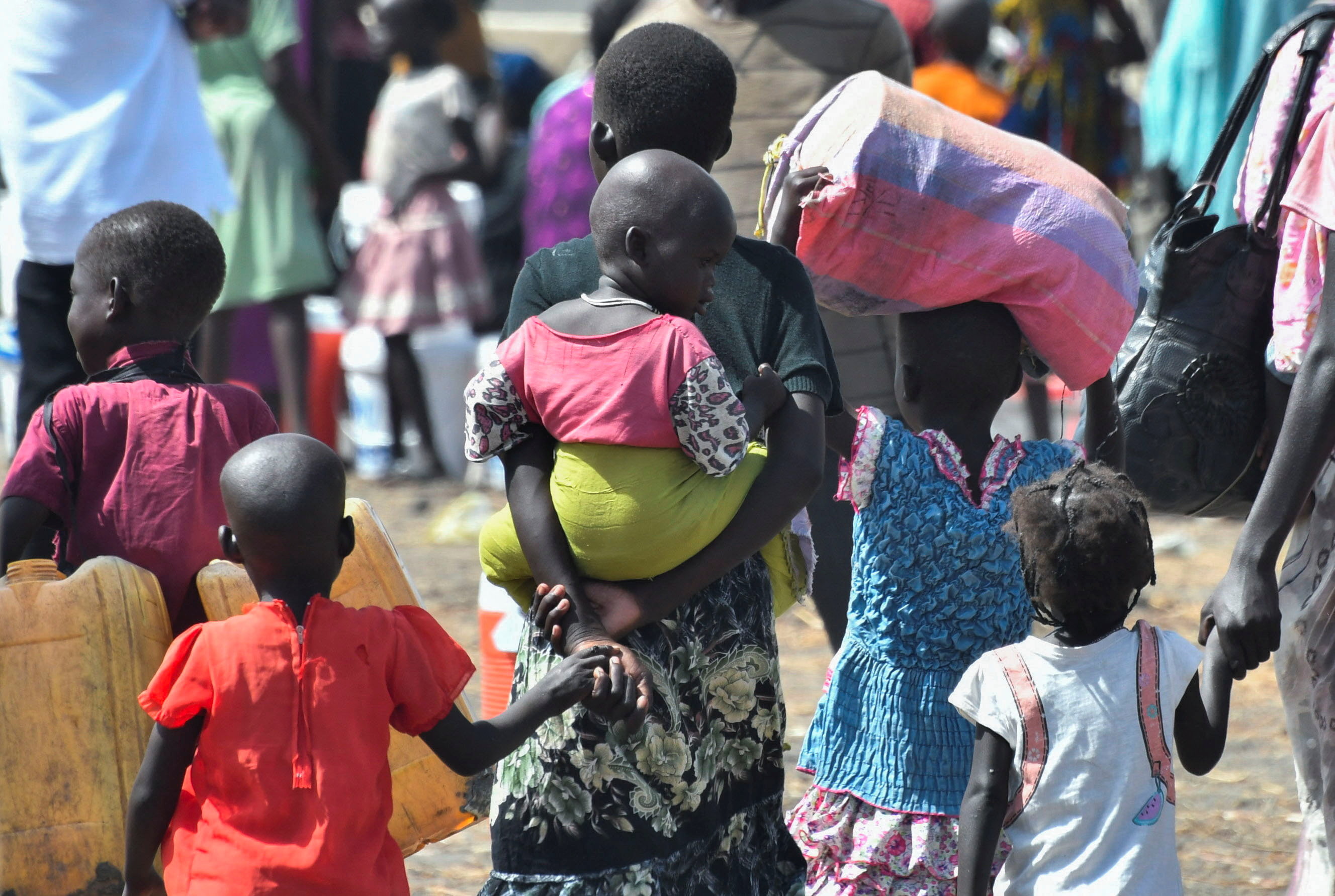 FILE PHOTO: Children who fled the war-torn Sudan following the outbreak of fighting between the Sudanese army and the paramilitary Rapid Support Forces (RSF), arrive at the United Nations High Commissioner for Refugees (UNHCR) transit centre in Renk, near the border crossing point in Renk County of Upper Nile State, South Sudan May 1, 2023. REUTERS/Jok Solomun/File Photo