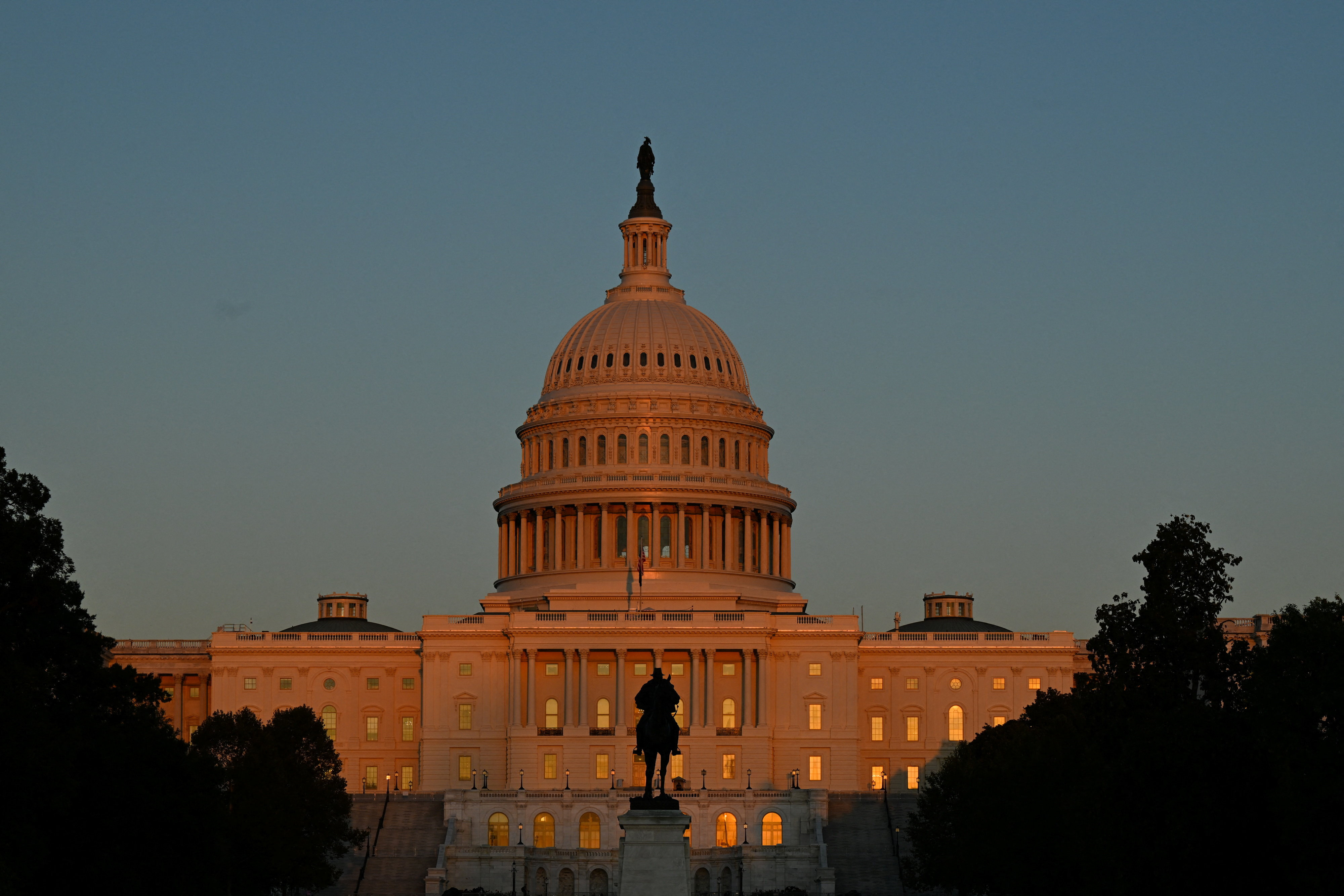 The U.S. Capitol as the sun begins to set during the first day of a partial government shutdown in Washington, D.C., U.S., October 1, 2025 [Annabelle Gordon/Reuters]