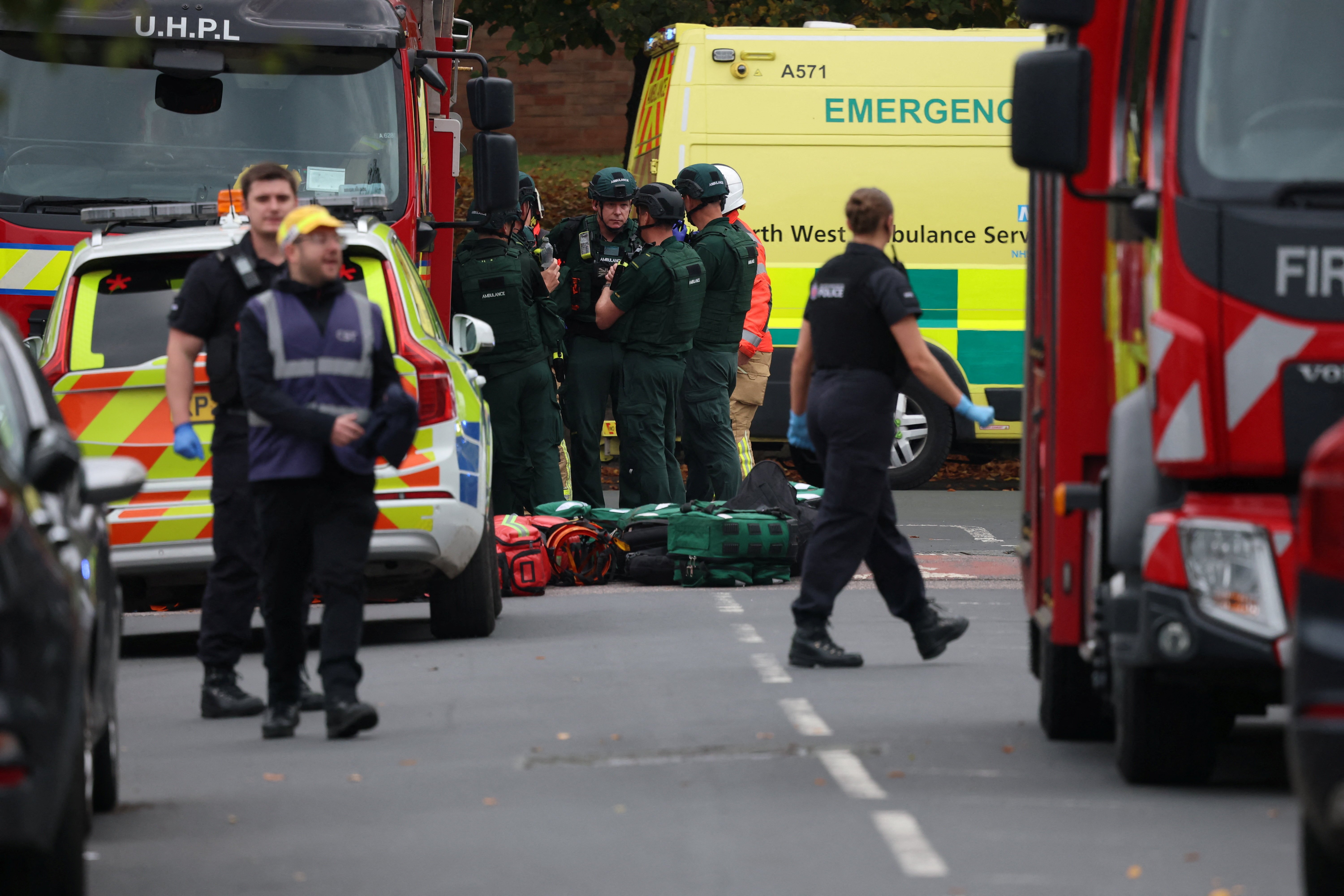 Emergency personnel work at the scene following an incident outside a synagogue.