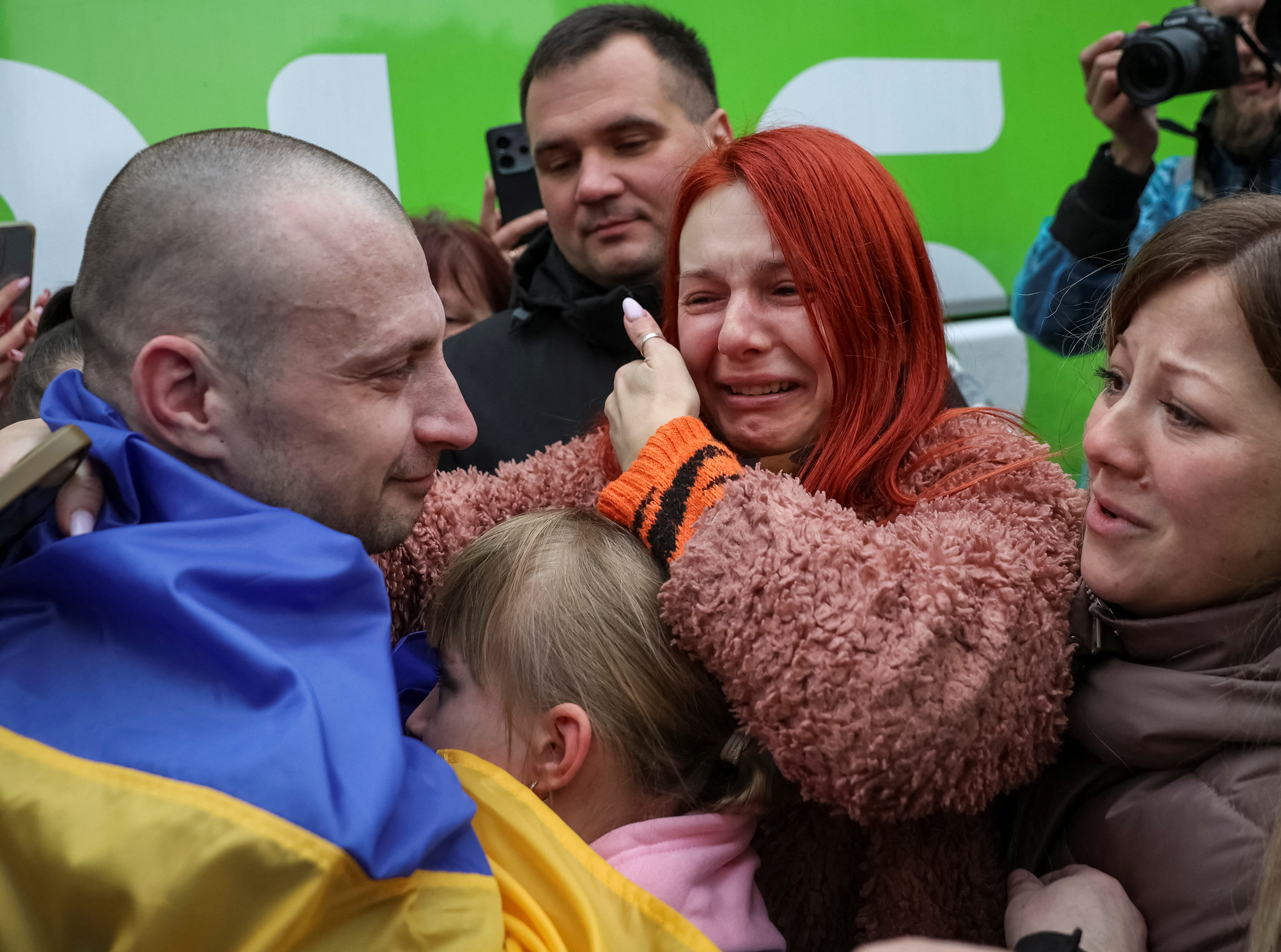 Freed Ukrainian prisoner of war (POW) reacts as he embraces his relatives after a swap, amid Russia's attack on Ukraine, in an undisclosed location in Ukraine October 2, 2025. REUTERS/Anatolii Stepanov