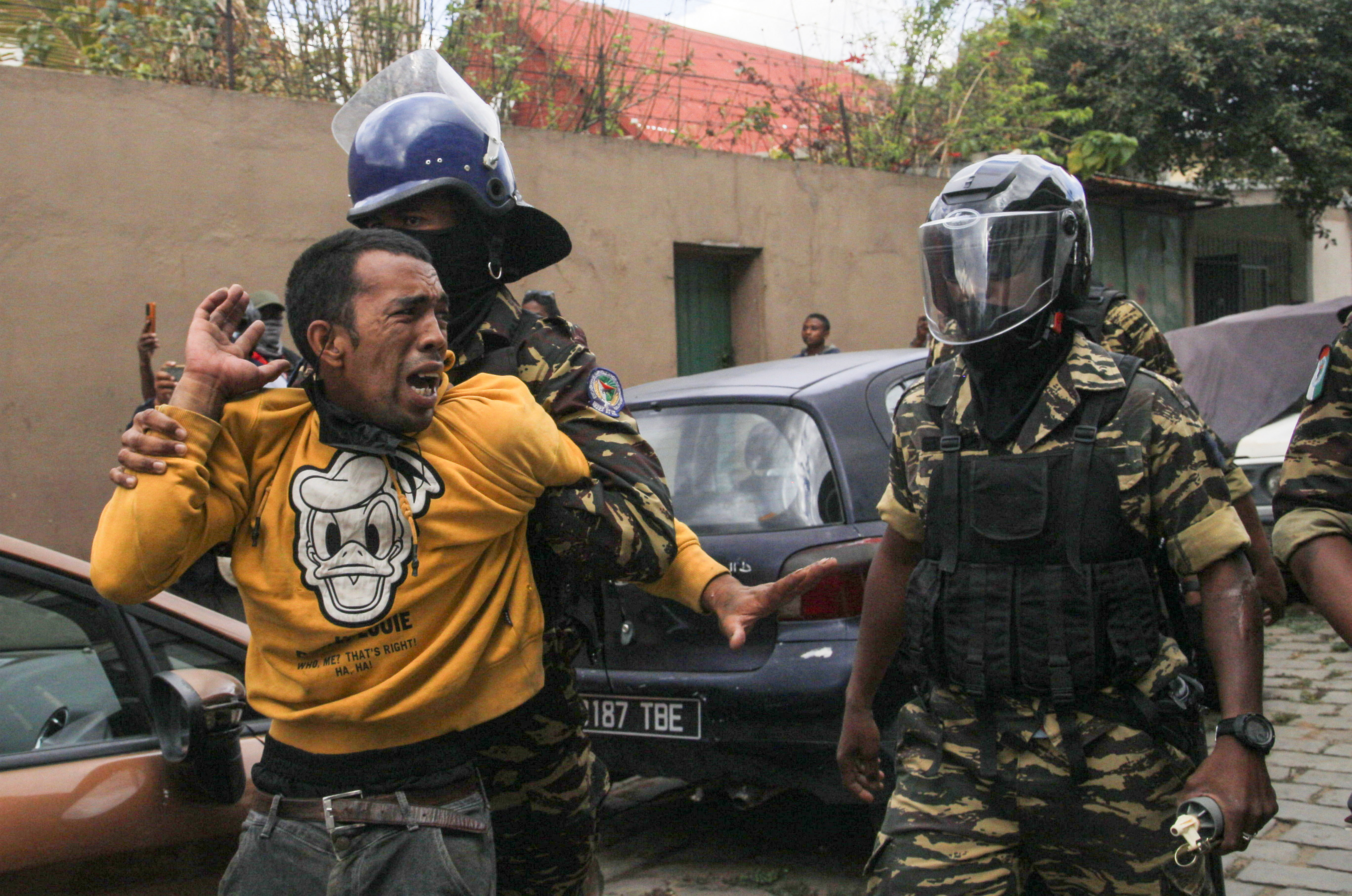 A protester gets detained during a nationwide youth-led protest over worsening water shortages and power outages, and demands for the resignation of Madagascar President Andry Rajoelina
