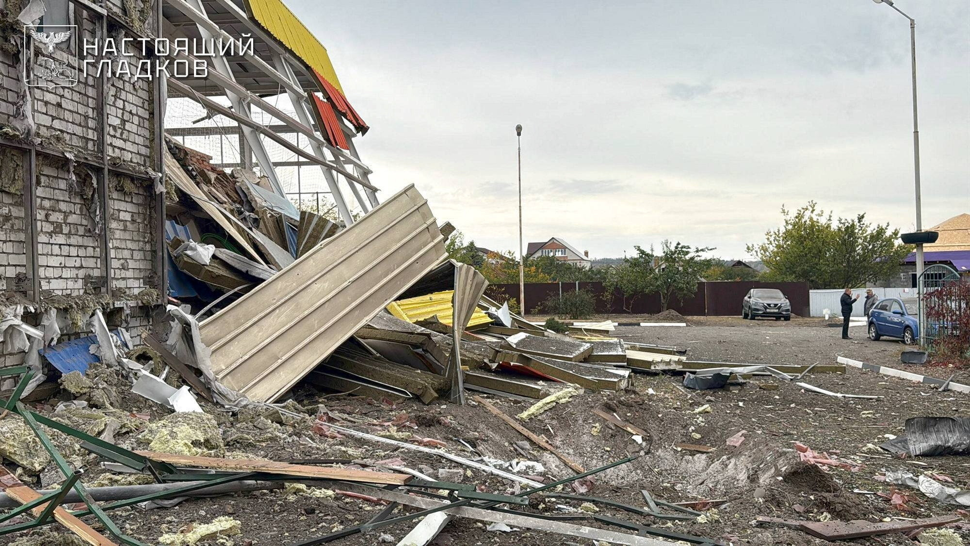 A crater next to a sports complex building destroyed by what local authorities called a recent Ukrainian missile attack in the course of Russia-Ukraine conflict, in the settlement of Maslova Pristan in the Belgorod Region, Russia October 8, 2025. Governor of Belgorod Region Vyacheslav Gladkov via Telegram/Handout via REUTERS ATTENTION EDITORS - THIS IMAGE HAS BEEN SUPPLIED BY A THIRD PARTY. NO RESALES. NO ARCHIVES. MANDATORY CREDIT. WATERMARK FROM SOURCE.