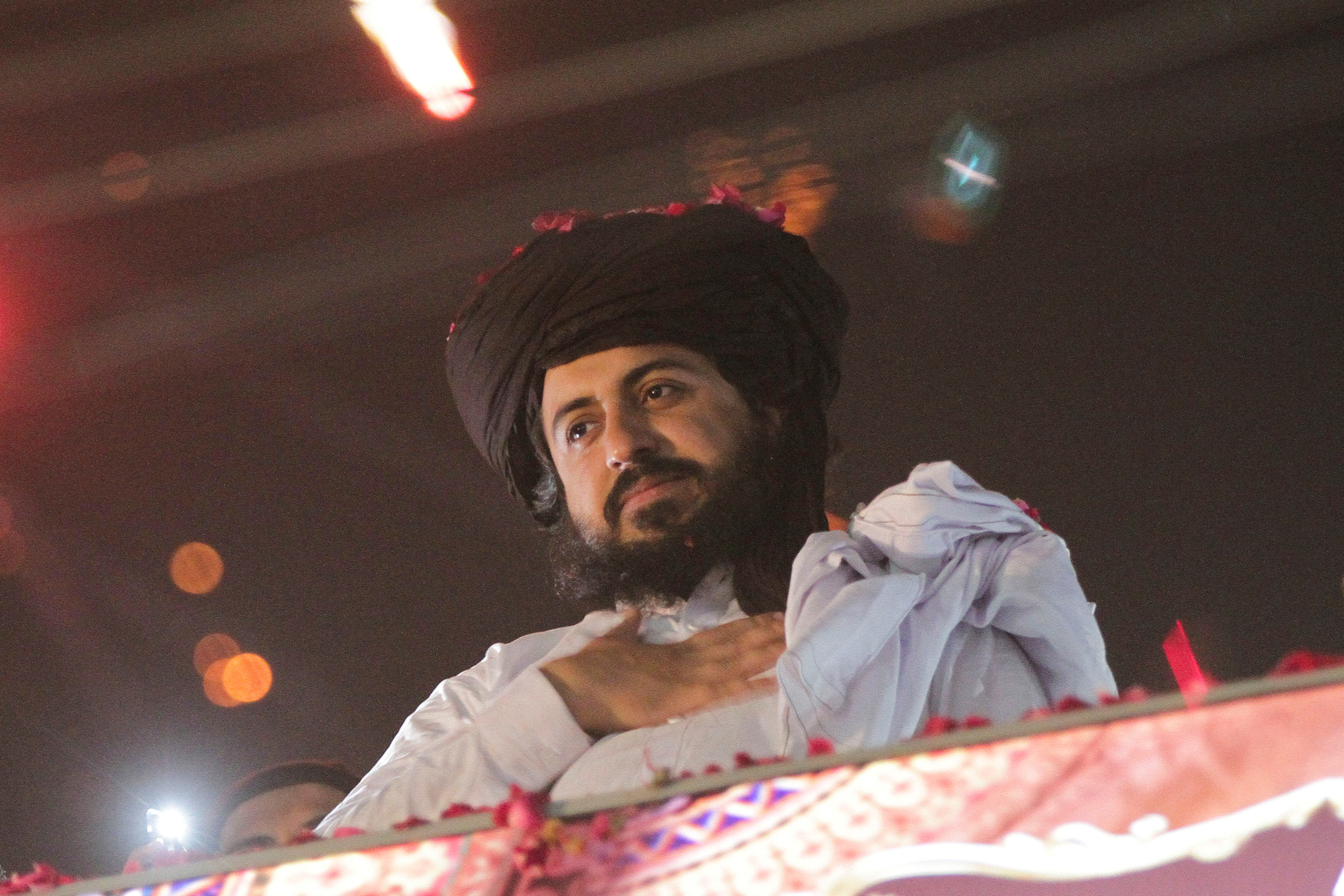 FILE PHOTO: Saad Hussain Rizvi, chief of Islamist political party Tehrik-e-Labaik Pakistan (TLP), gestures to his supporters after being released from jail in Lahore, Pakistan, November 18, 2021. REUTERS/Mohsin Raza/File Photo