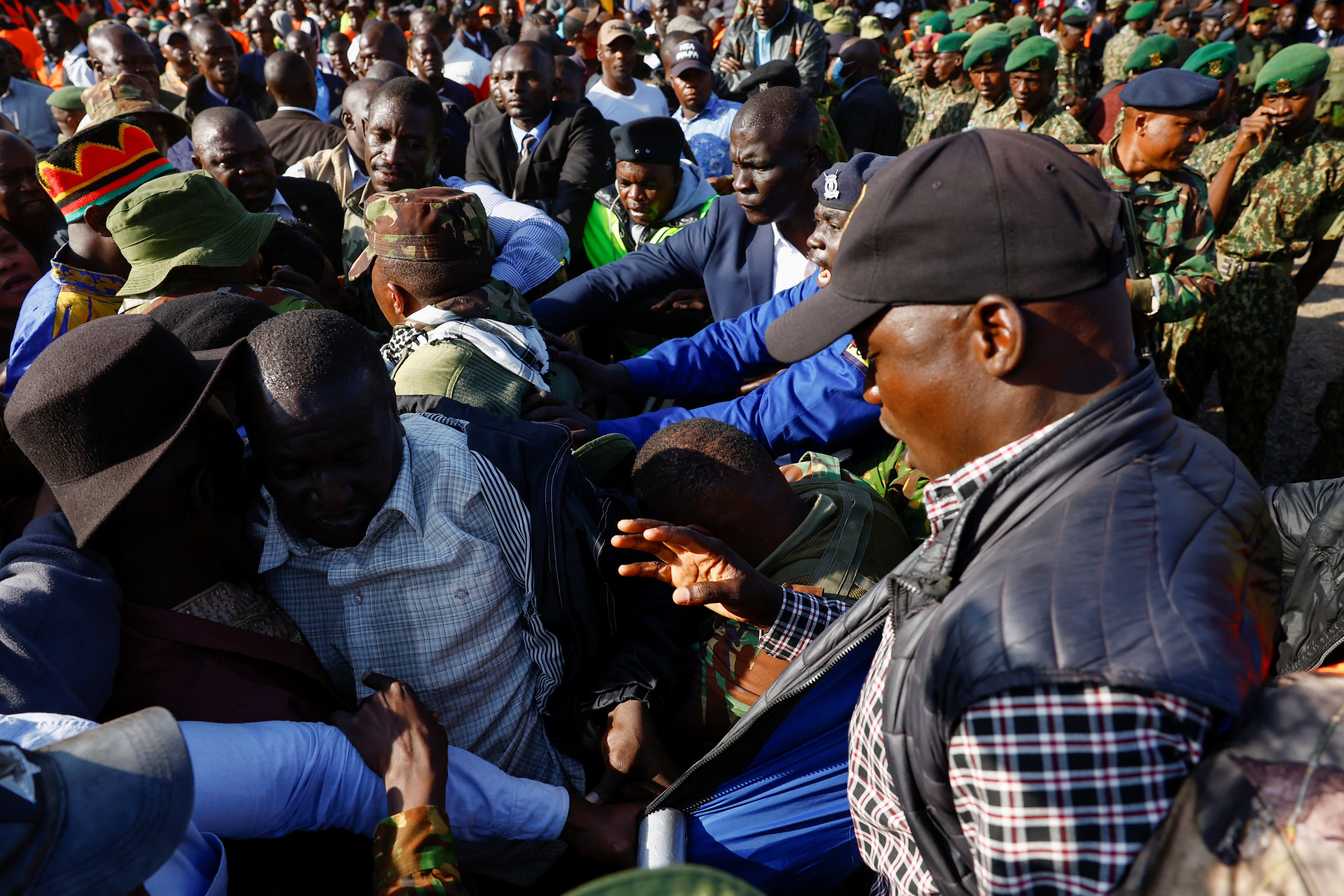 Security personnel control the crowd as mourners gather to attend a funeral Mass for Kenya's former Prime Minister Raila Odinga, who died while receiving medical treatment in India, at the Jaramogi Oginga Odinga University of Science and Technology in Bondo, Siaya County, Kenya, October 19, 2025. REUTERS/Thomas Mukoya