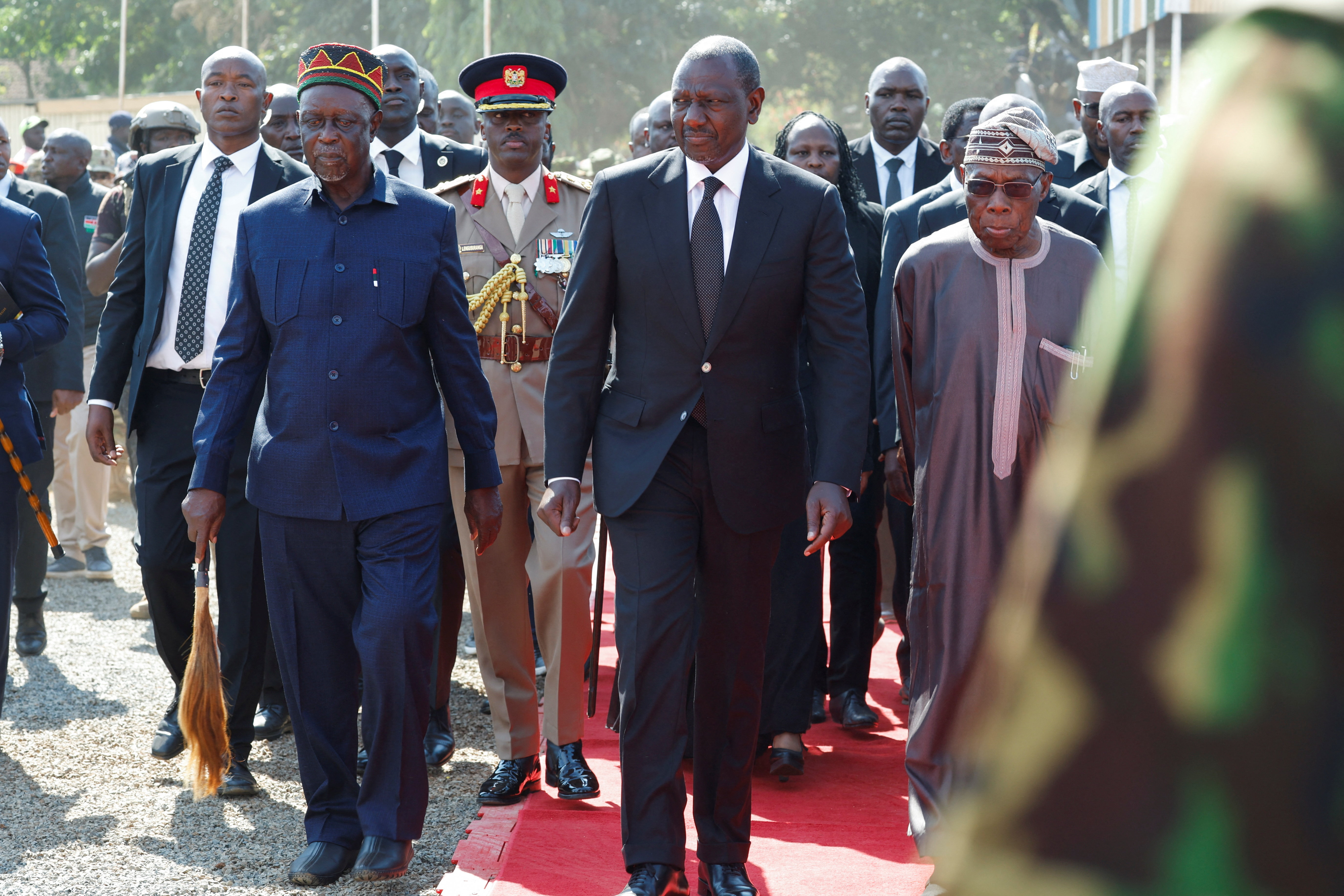 Kenya's President William Ruto walks with Former Kenyan Prime Minister Raila Odinga's brother, Oburu Odinga, on the day of Raila Odinga's funeral Mass, who died while receiving medical treatment in India, at the Jaramogi Oginga Odinga University of Science and Technology in Bondo, Siaya County, Kenya, October 19, 2025. REUTERS/Monicah Mwangi