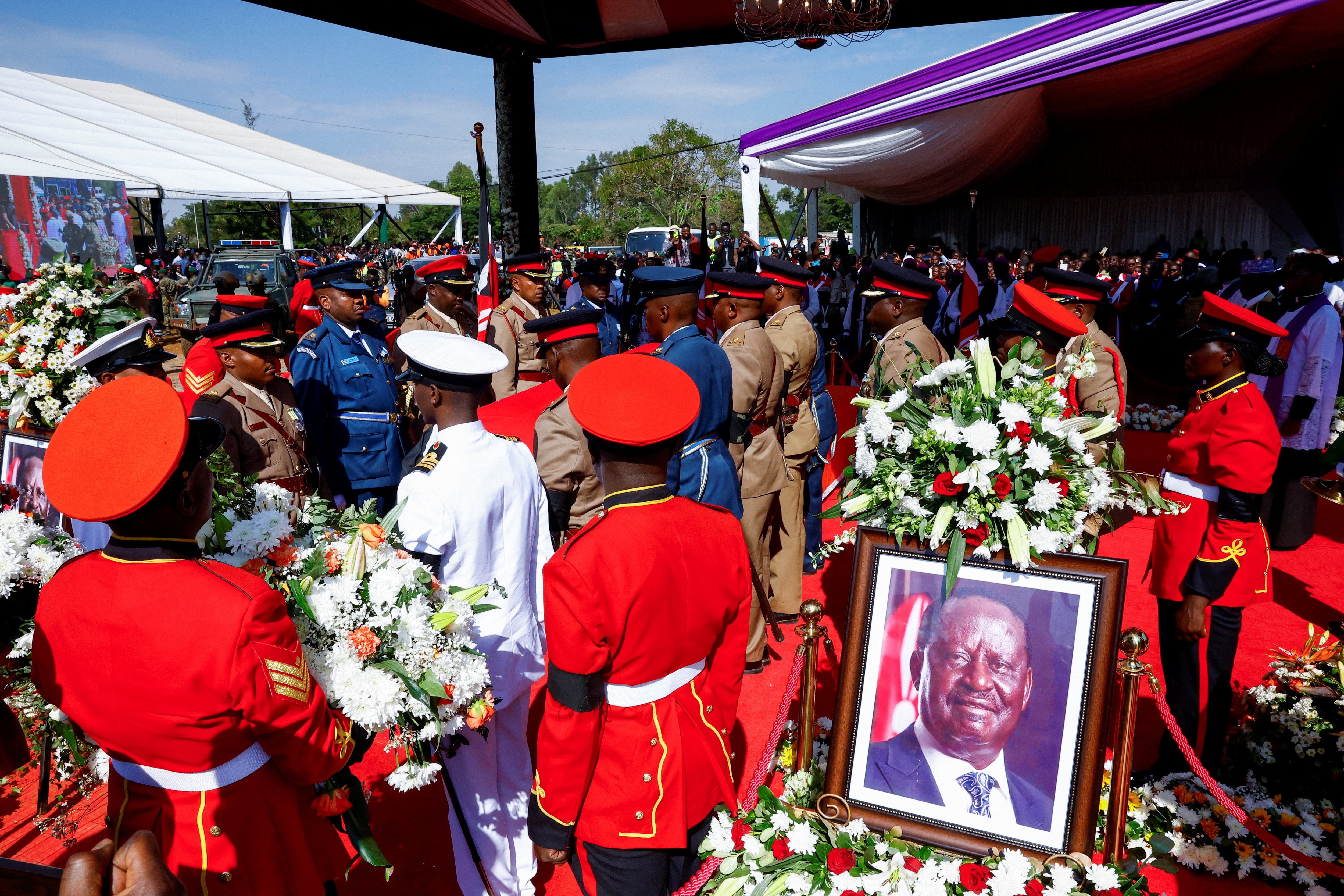 Members of the Kenya Defence Forces (KDF) stand next to the coffin of Kenya's former Prime Minister Raila Odinga, who died while receiving medical treatment in India, during a funeral Mass at the Jaramogi Oginga Odinga University of Science and Technology in Bondo, Siaya County, Kenya, October 19, 2025. REUTERS/Thomas Mukoya
