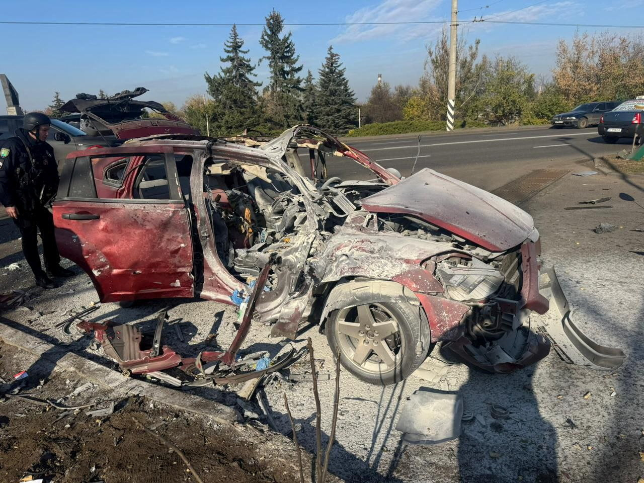 A destroyed car hit by a Russian drone that killed two Ukrainian journalists