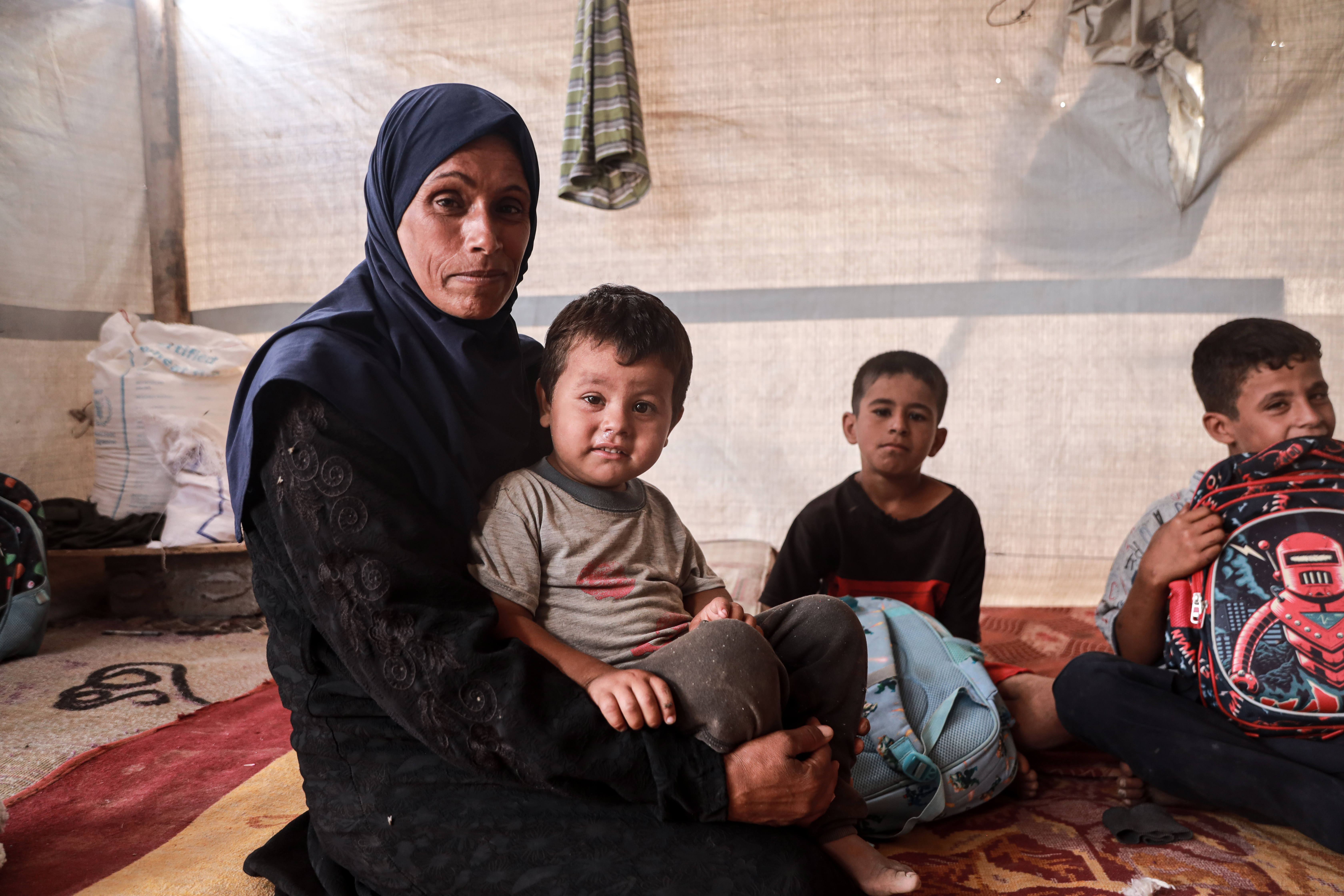 Jihan Abu Mandeel and her four boys in their tiny tent.