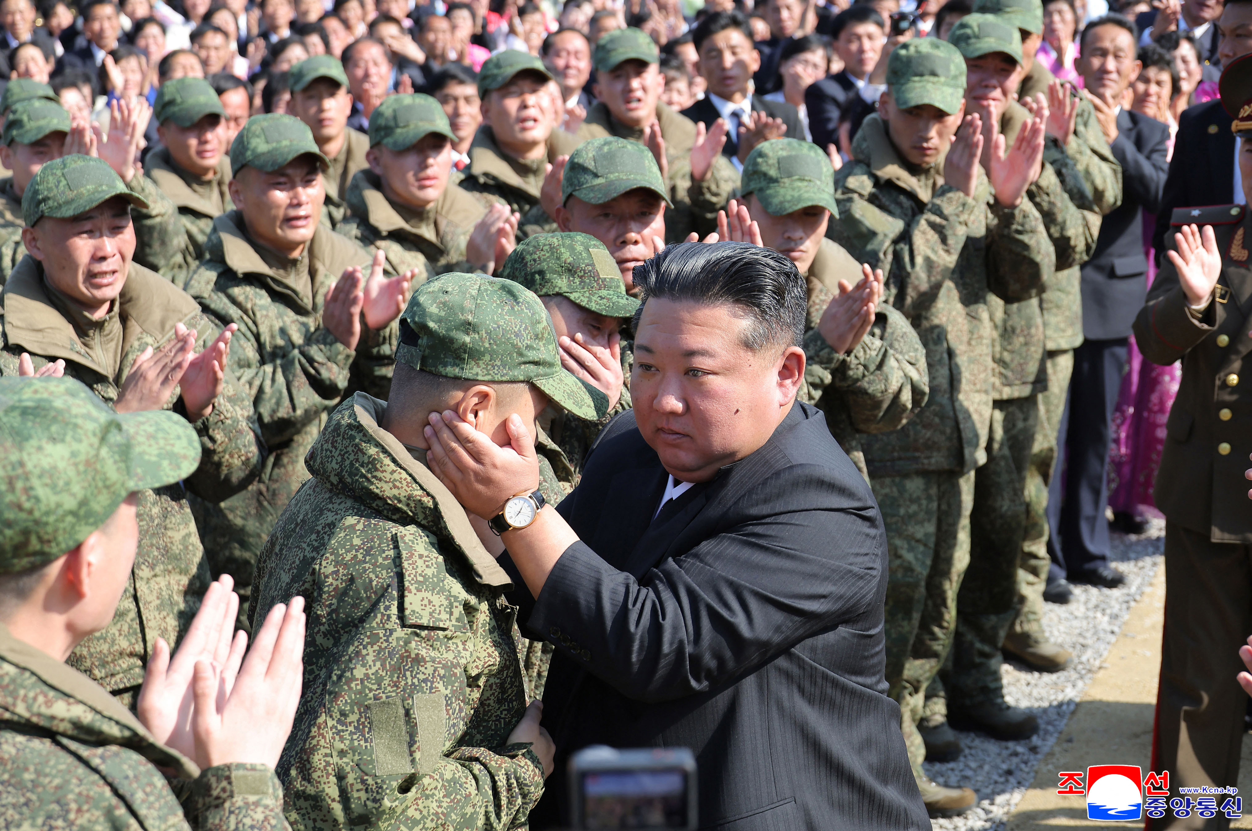 North Korean leader Kim Jong Un (C) encouraging soldiers.