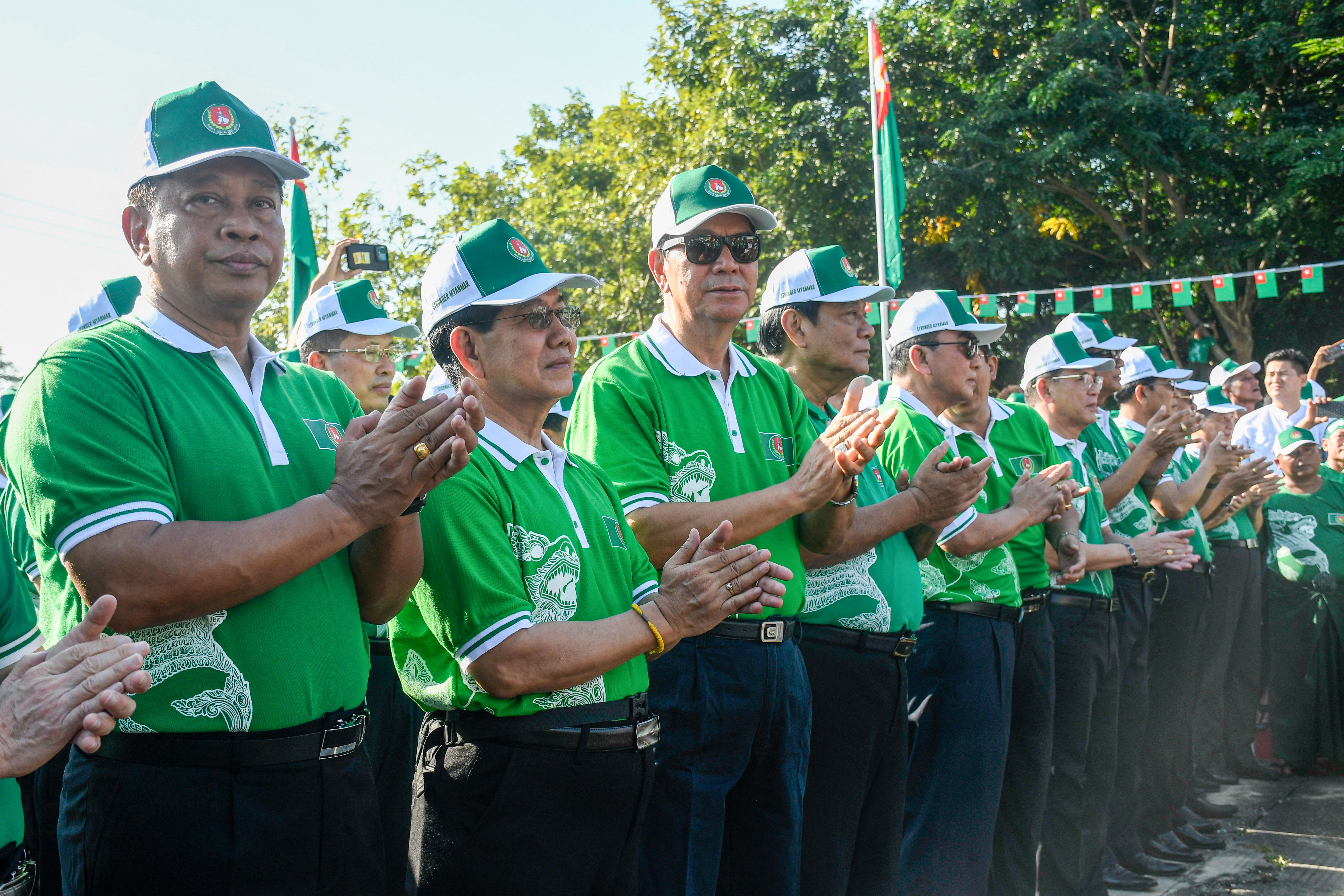 Myanmar's retired General Tin Aung San, left, a candidate for the army-backed ruling Union Solidarity and Development Party (USDP) attends a campaign kick-off event in Naypyidaw